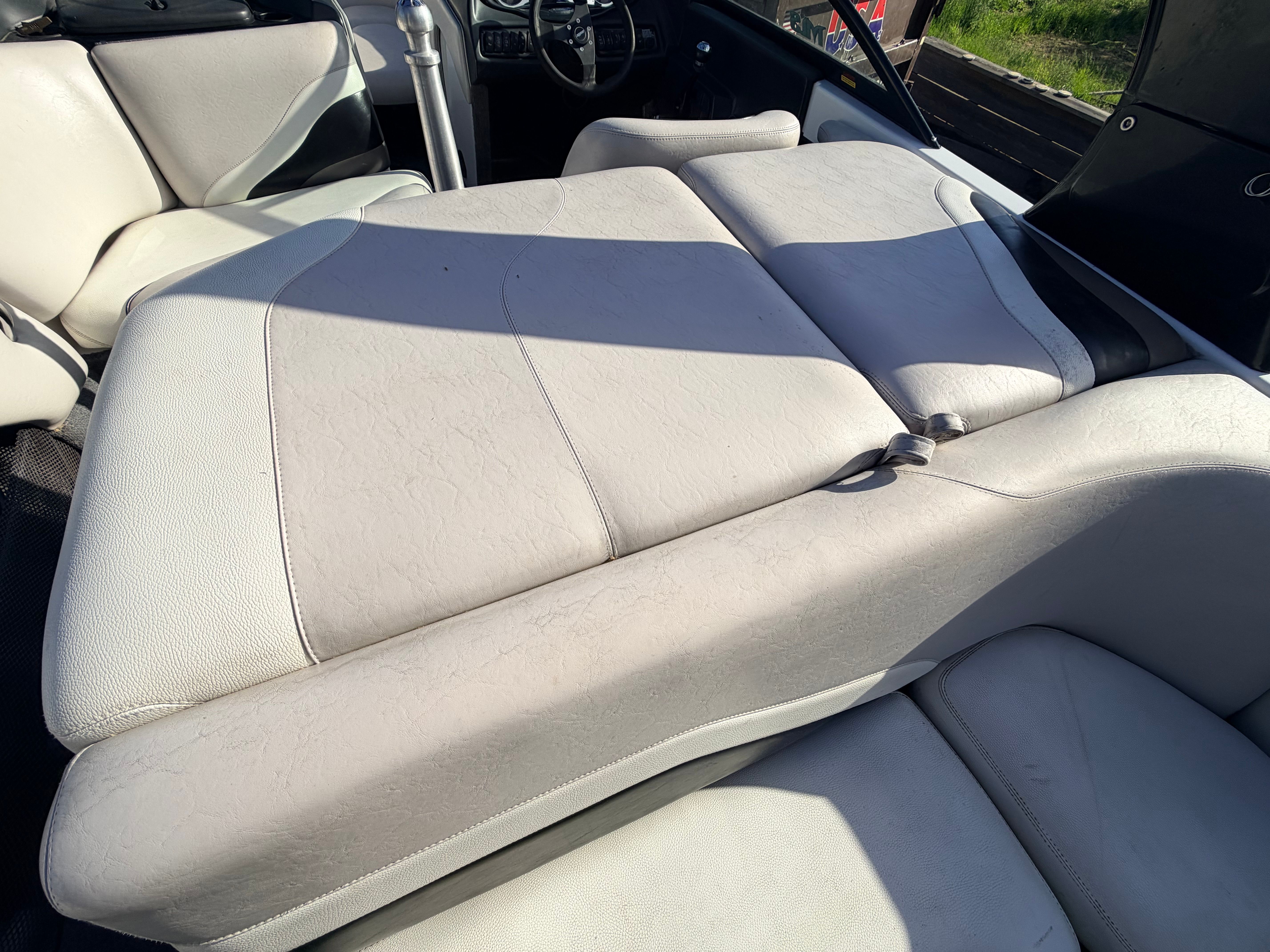 Interior of a 2006 Malibu iRide boat with white seating.
