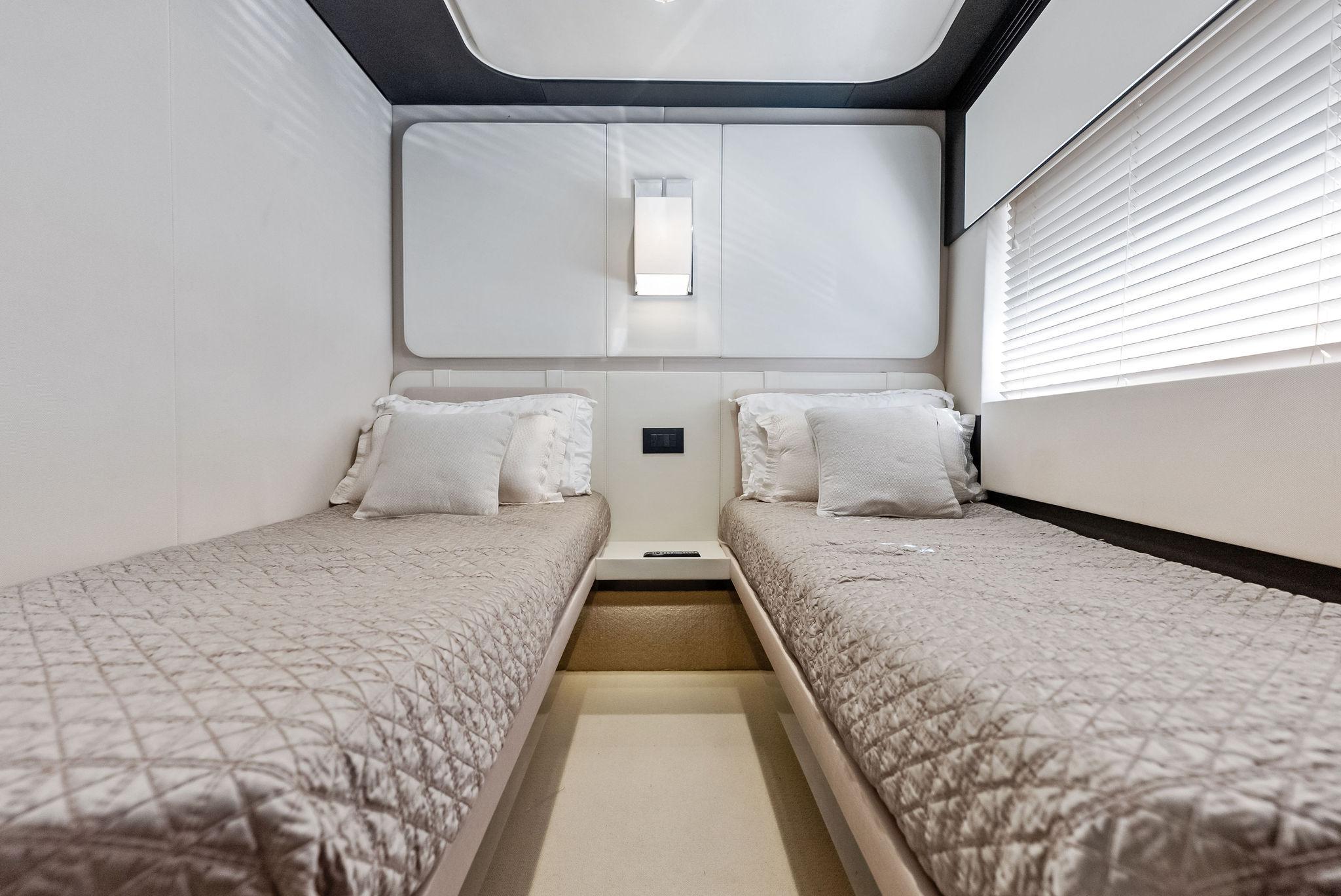Luxurious twin cabin interior of 2017 Azimut 77S yacht with modern design.