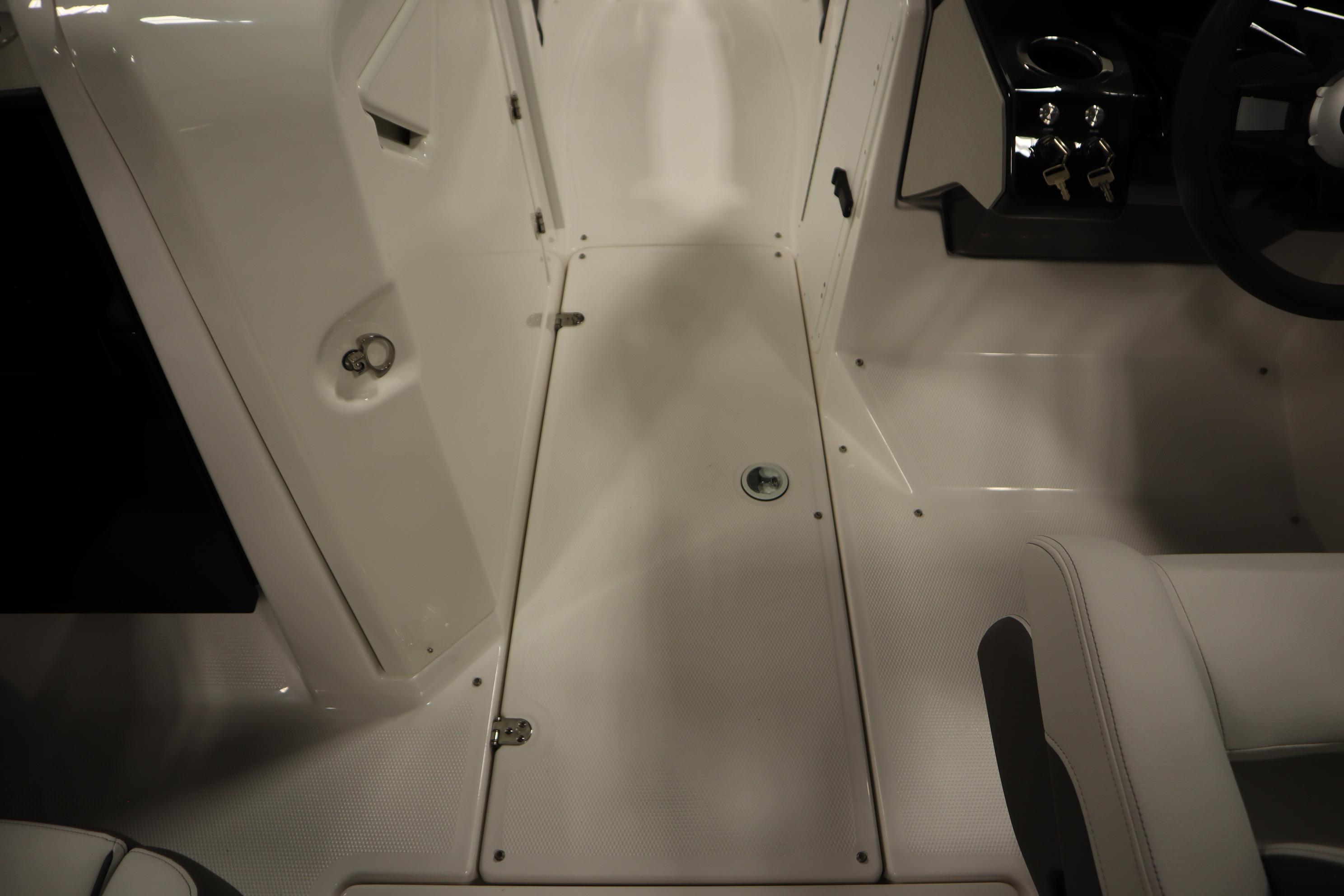 2026 Yamaha Boats AR250 interior, featuring sleek white flooring and modern design elements.