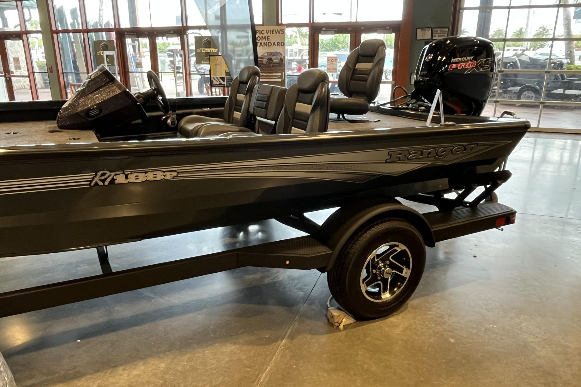 2026 Ranger RT188P boat displayed indoors with sleek design and comfortable seating.