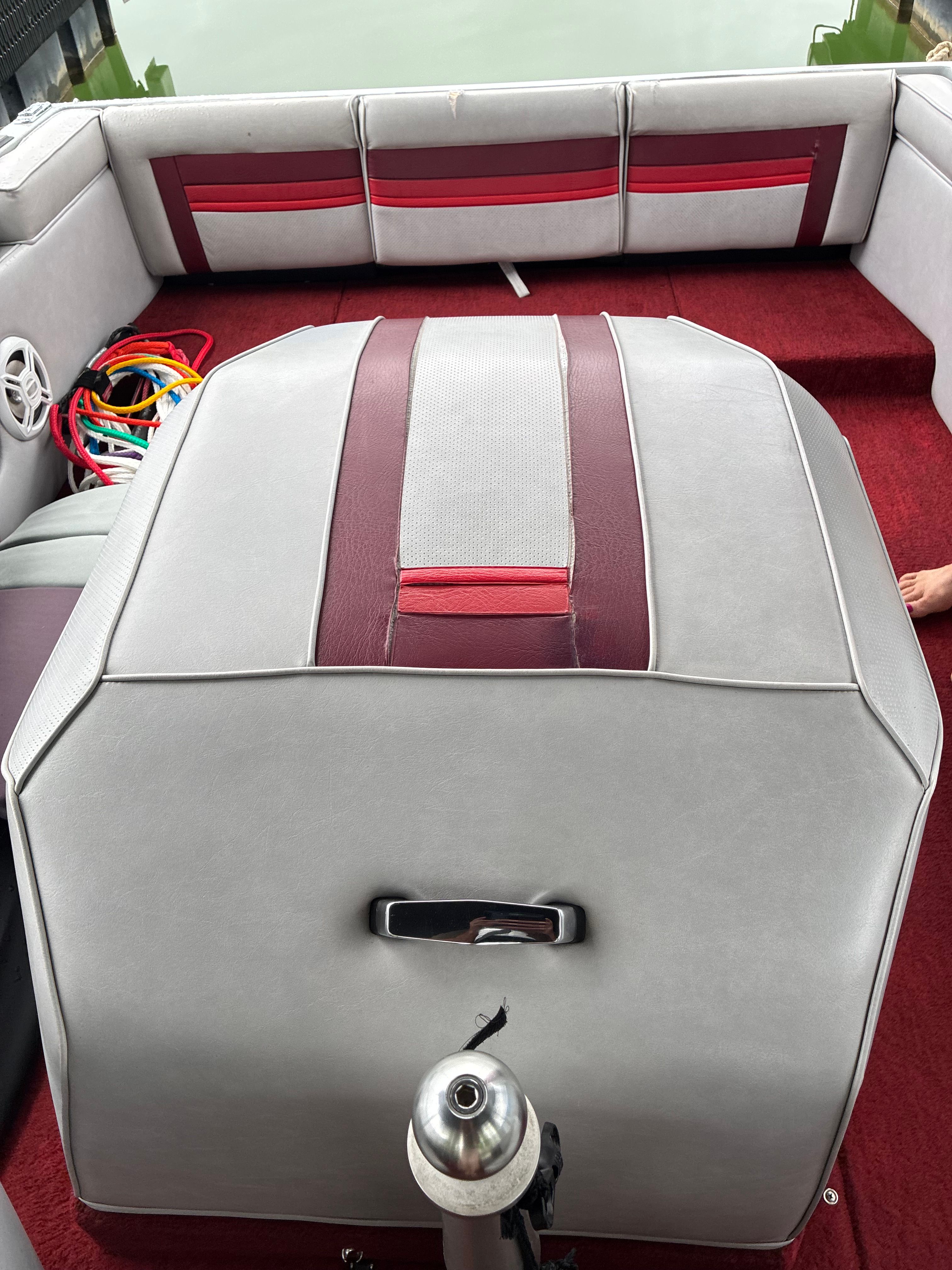 Interior of a 1989 MasterCraft TriStar 190 with gray and red upholstery.