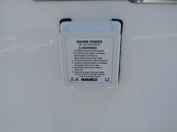 Shore power connection on a 2024 Wellcraft 352 Fisherman boat.