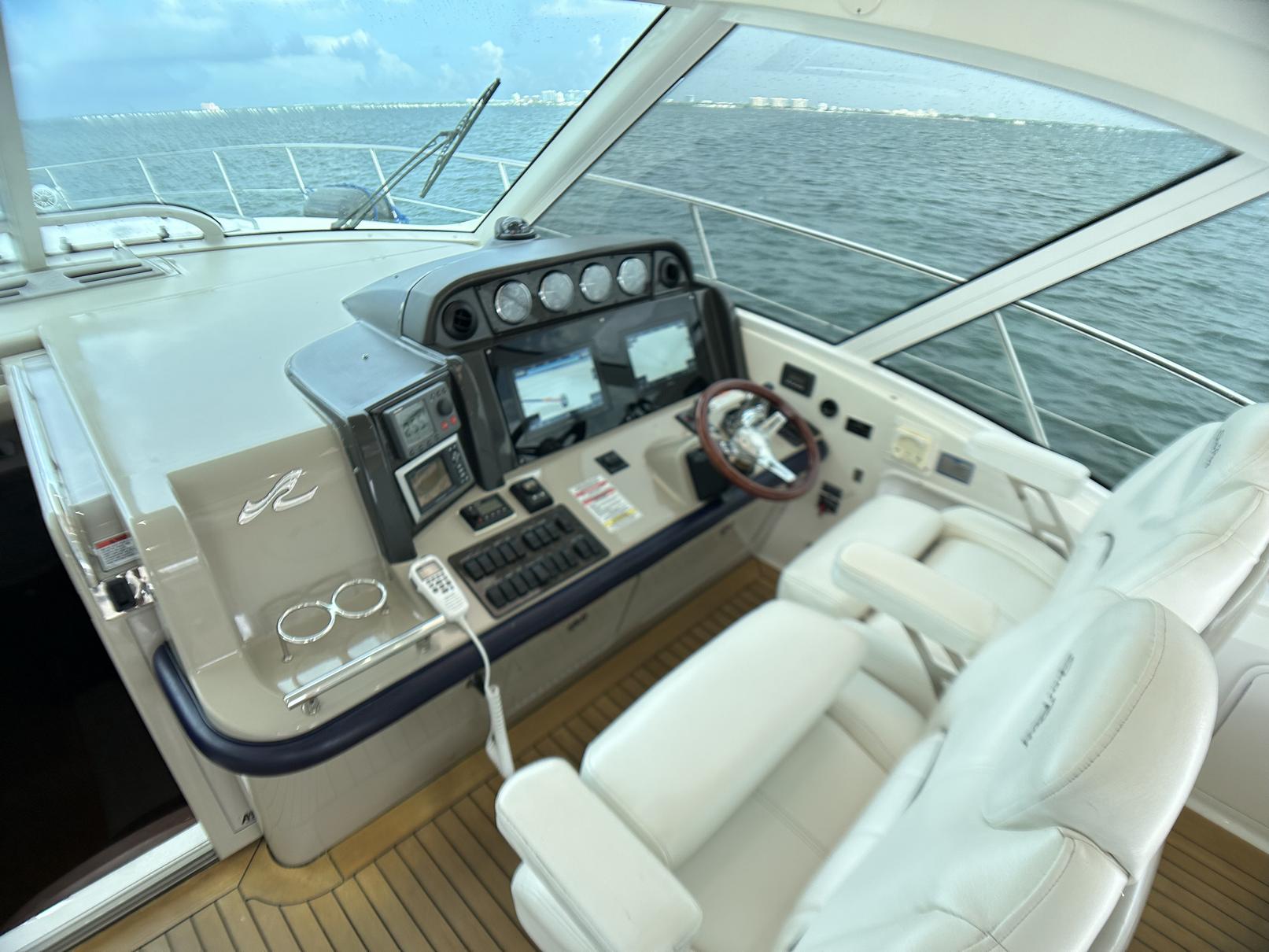 2008 Sea Ray 480 Sundancer helm with modern controls and ocean view.