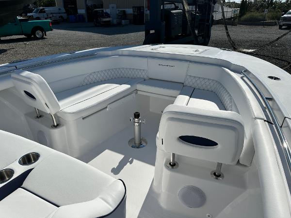 Luxurious 2025 Southport 33 DC boat interior with white seating and modern design.