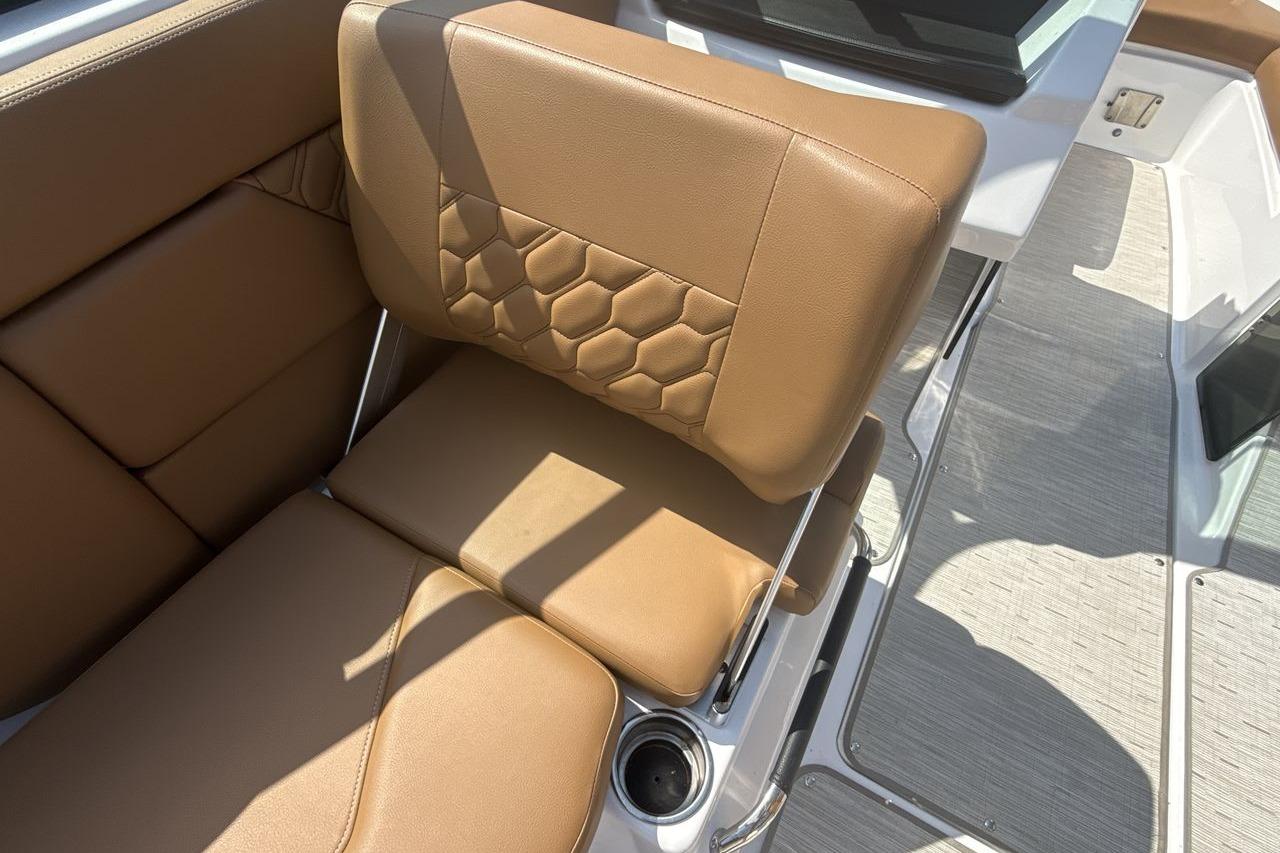 2024 Four Winns H1 OB boat interior with tan leather seating and hexagonal stitching design.