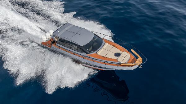 2025 Hanover 415 yacht cruising on open water, top view.