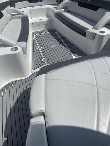 2017 Mystic Powerboats M4200 interior with white leather seating and grey flooring.