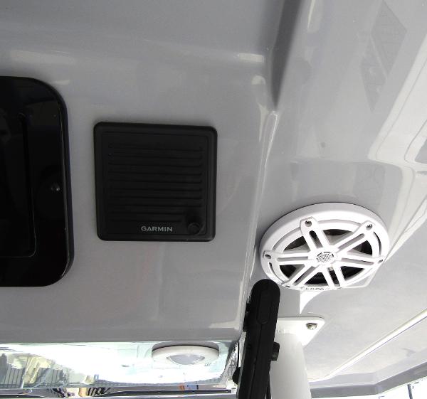 2024 Wellcraft 352 Fisherman boat ceiling with Garmin speaker and white marine speaker.