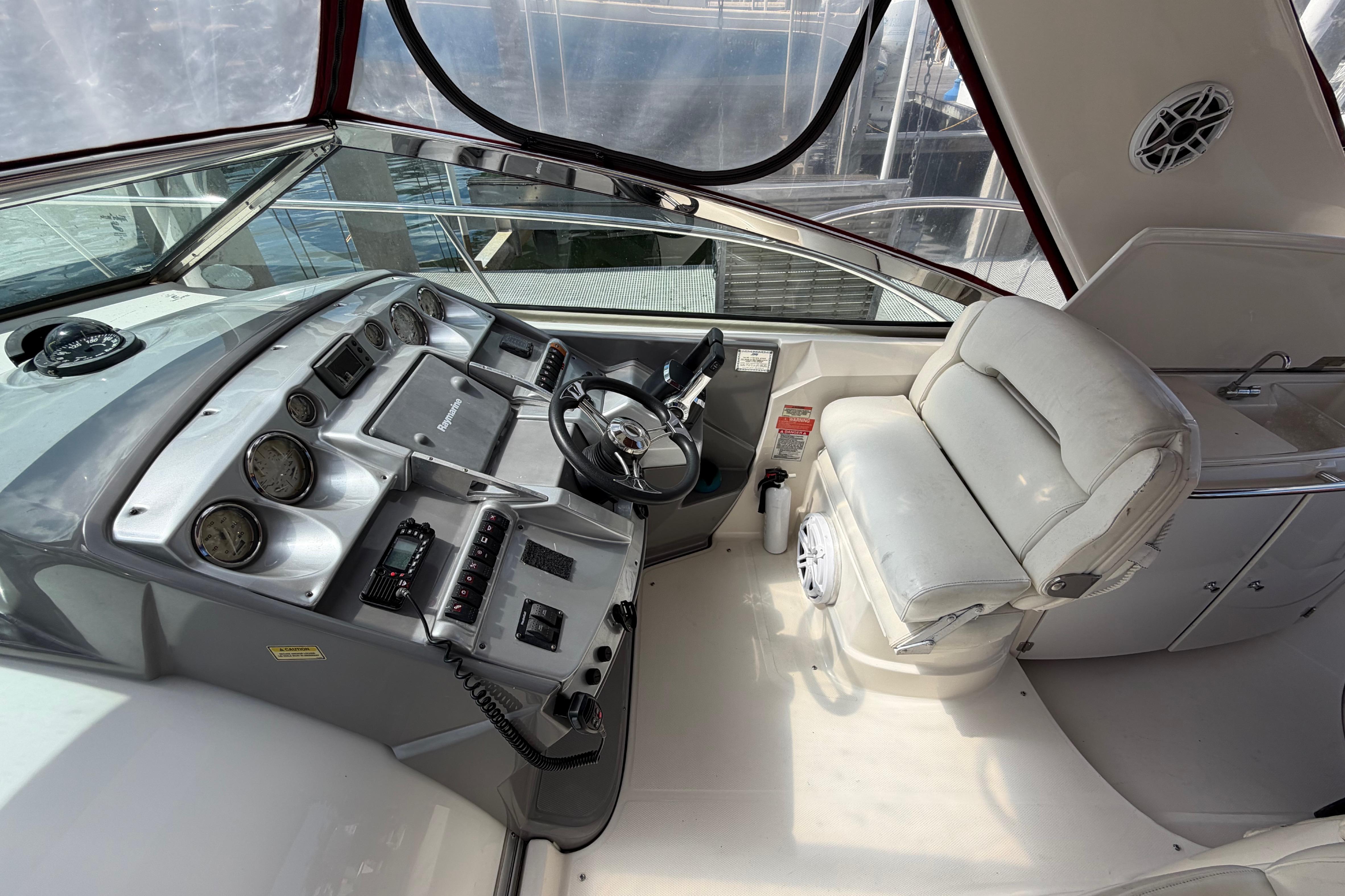 Cockpit of 2007 Monterey 350 Sport Yacht with steering wheel and control panel.