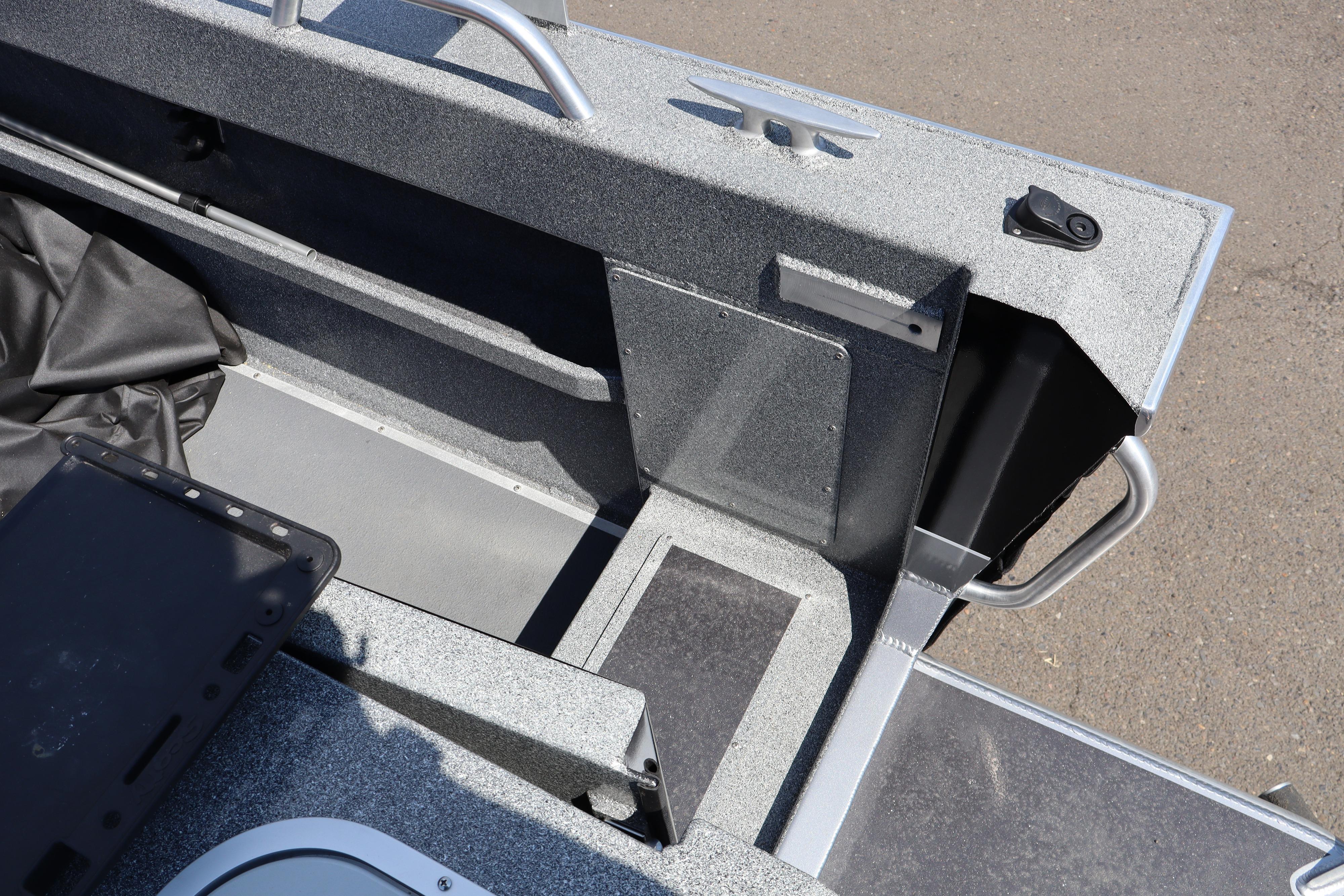 Interior view of 2025 NorthRiver SEAHAWK boat, showcasing seating and storage compartments.