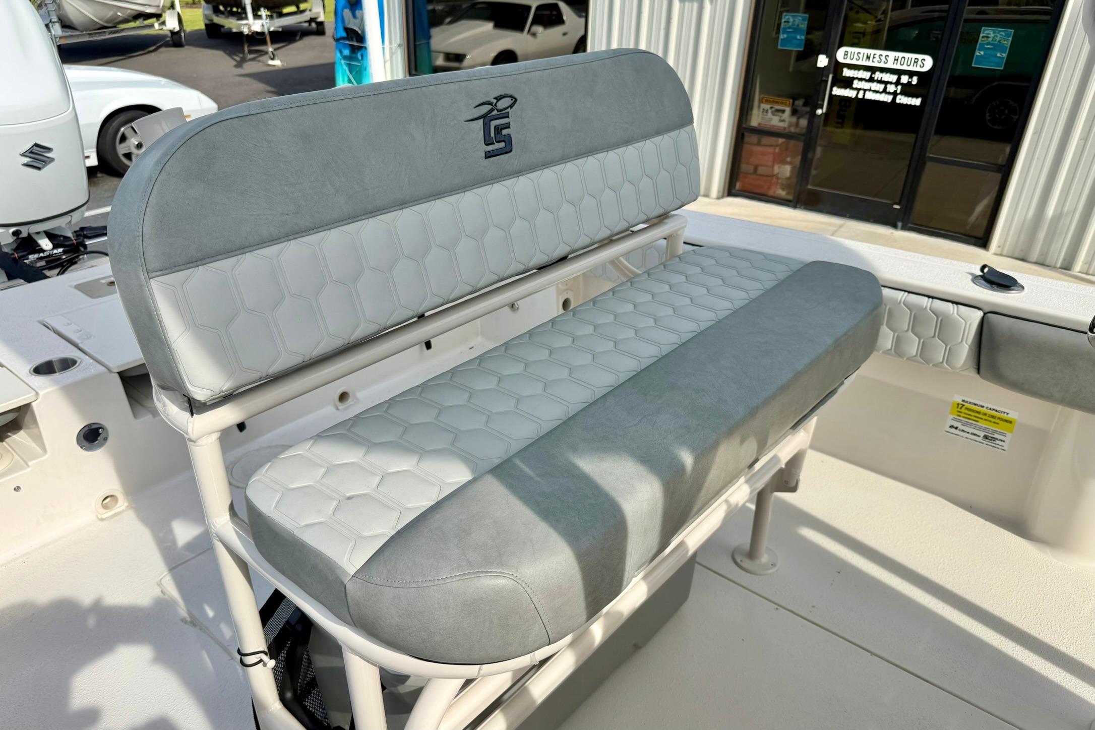 2026 Carolina Skiff 24 Ultra Elite boat seat with gray upholstery and hexagonal pattern.