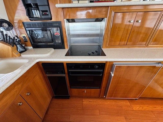 Kitchen area of 2002 Carver 570 Voyager Pilothouse yacht.