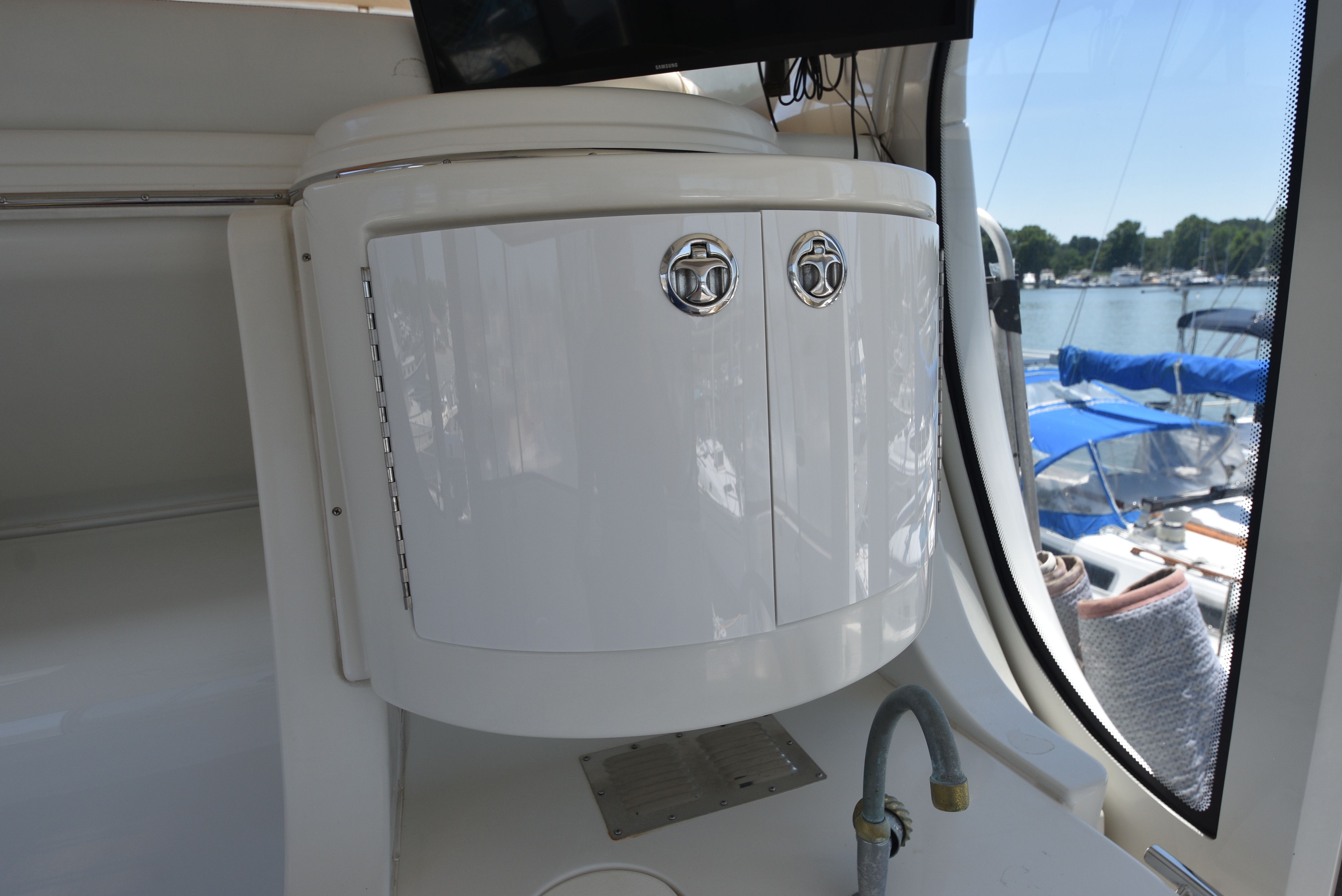 Interior of a 2004 Carver 466 Motor Yacht with a white cabinet and faucet.