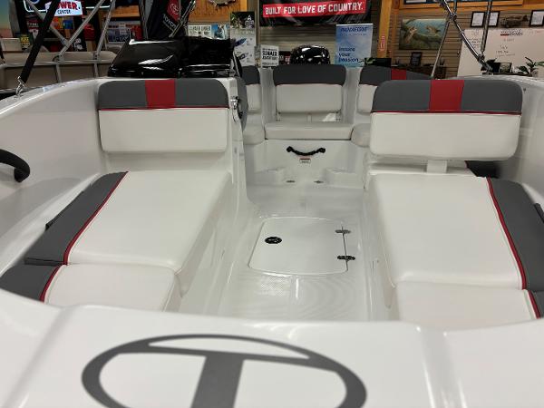 2023 Tahoe T16 boat interior with white and gray seating, red accents.