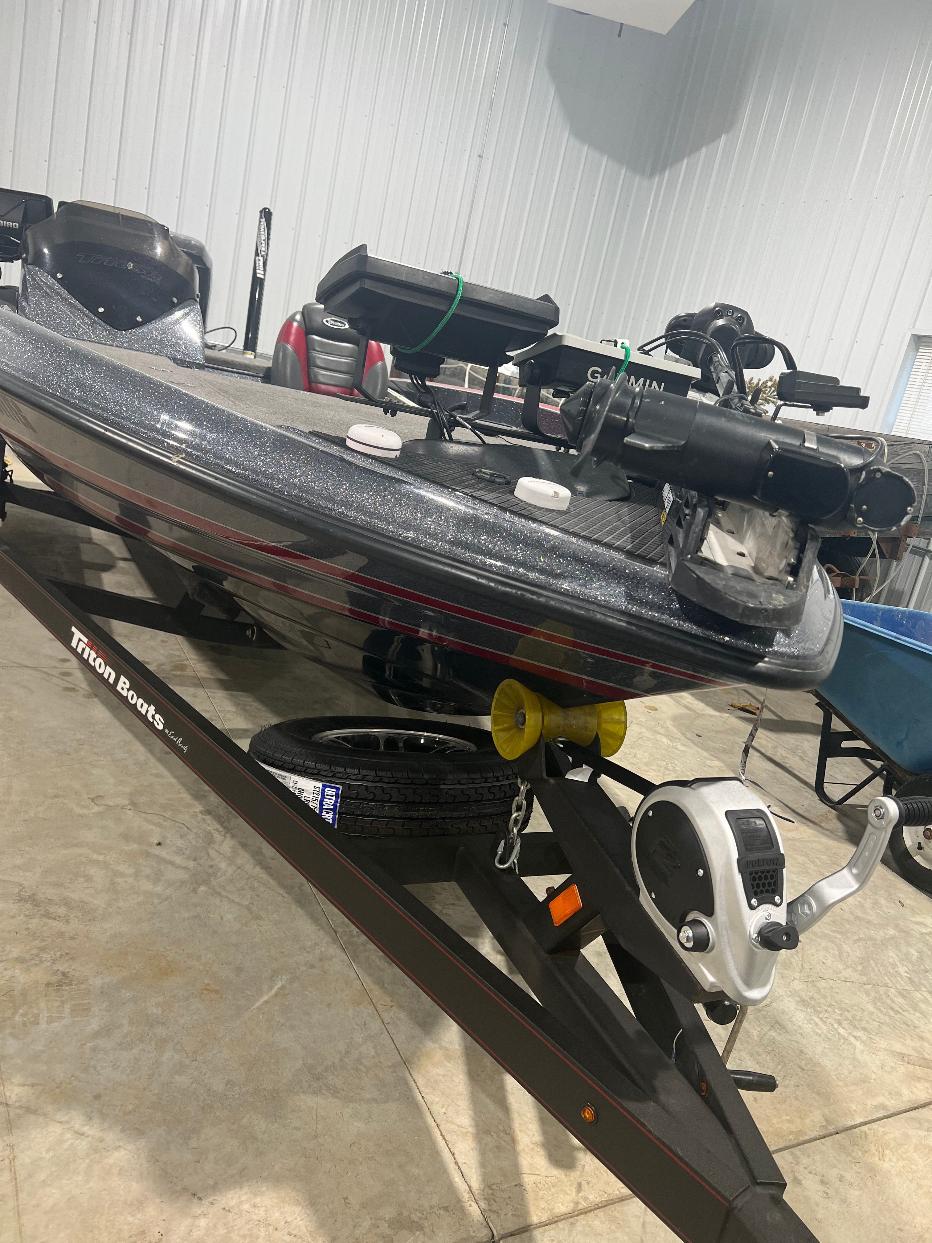 2015 Triton 18XS in a storage facility, with trailer and equipment.