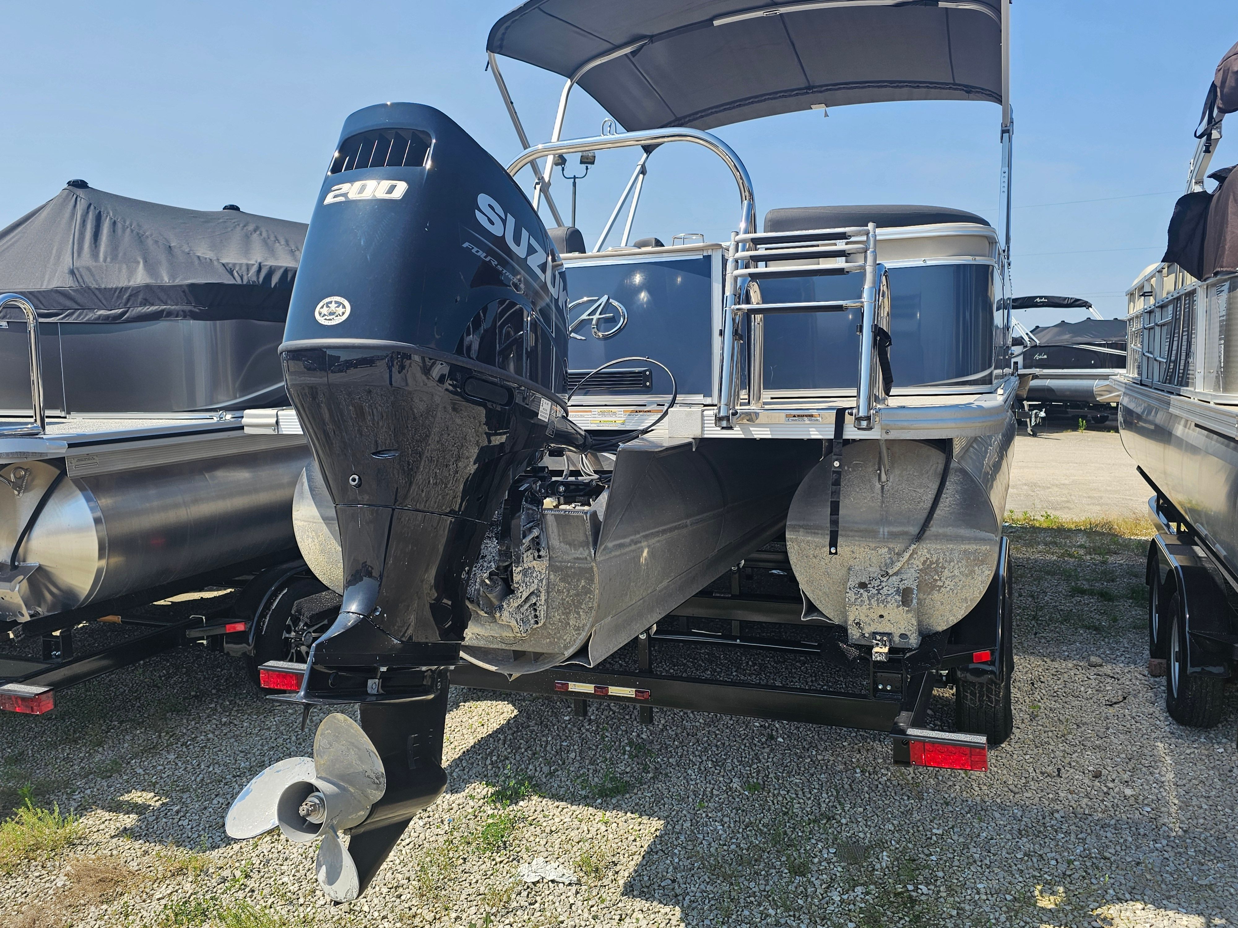 2024 Avalon LSZ 2385 QL pontoon boat with Suzuki 200 engine.