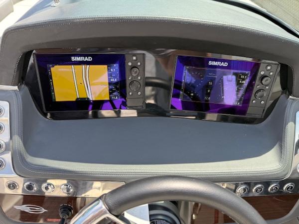 Dashboard of 2023 Chaparral 267 SSX with dual Simrad navigation displays.