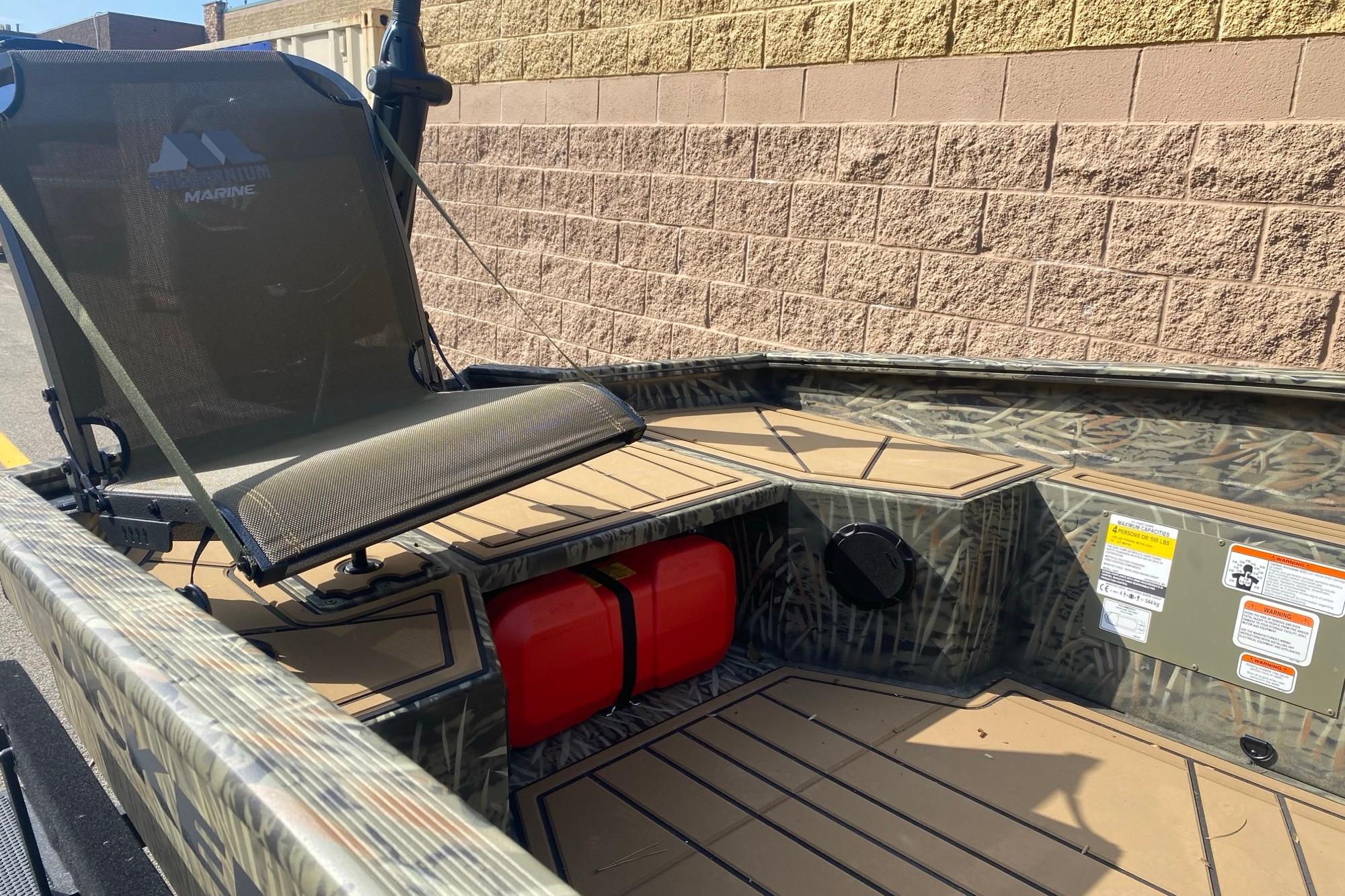 2026 Tracker Grizzly 1650 T Prairie Wings Edition boat interior with camo design and seating.