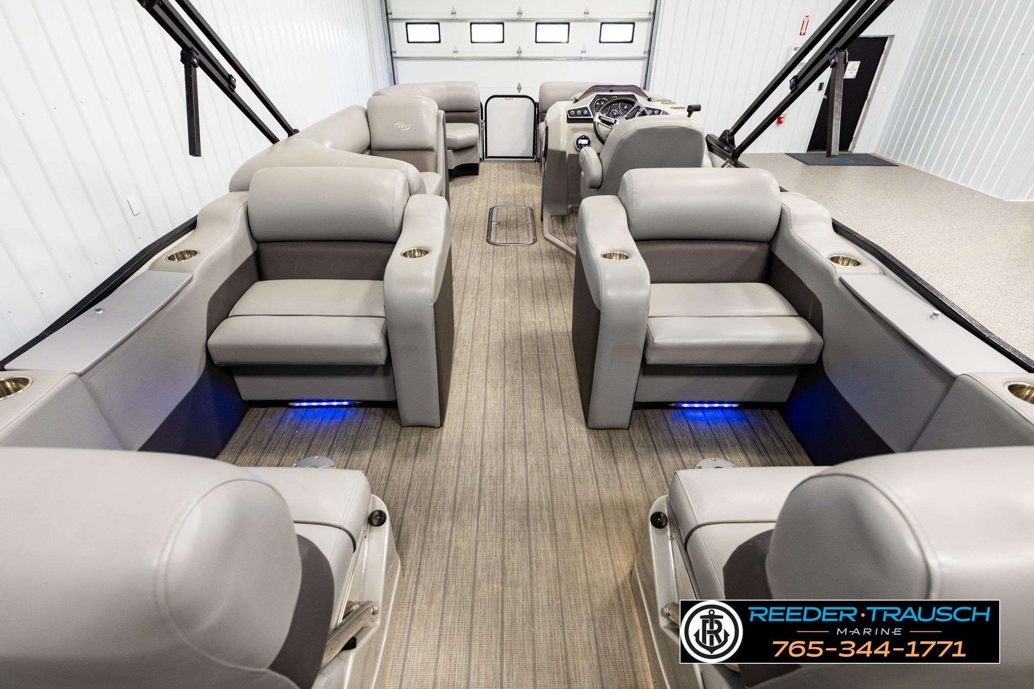 Luxurious interior of 2019 Manitou Oasis SR VP pontoon boat with plush seating.