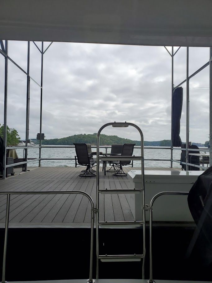 Deck of a 1996 Blue Water Motor Yacht with lake view.