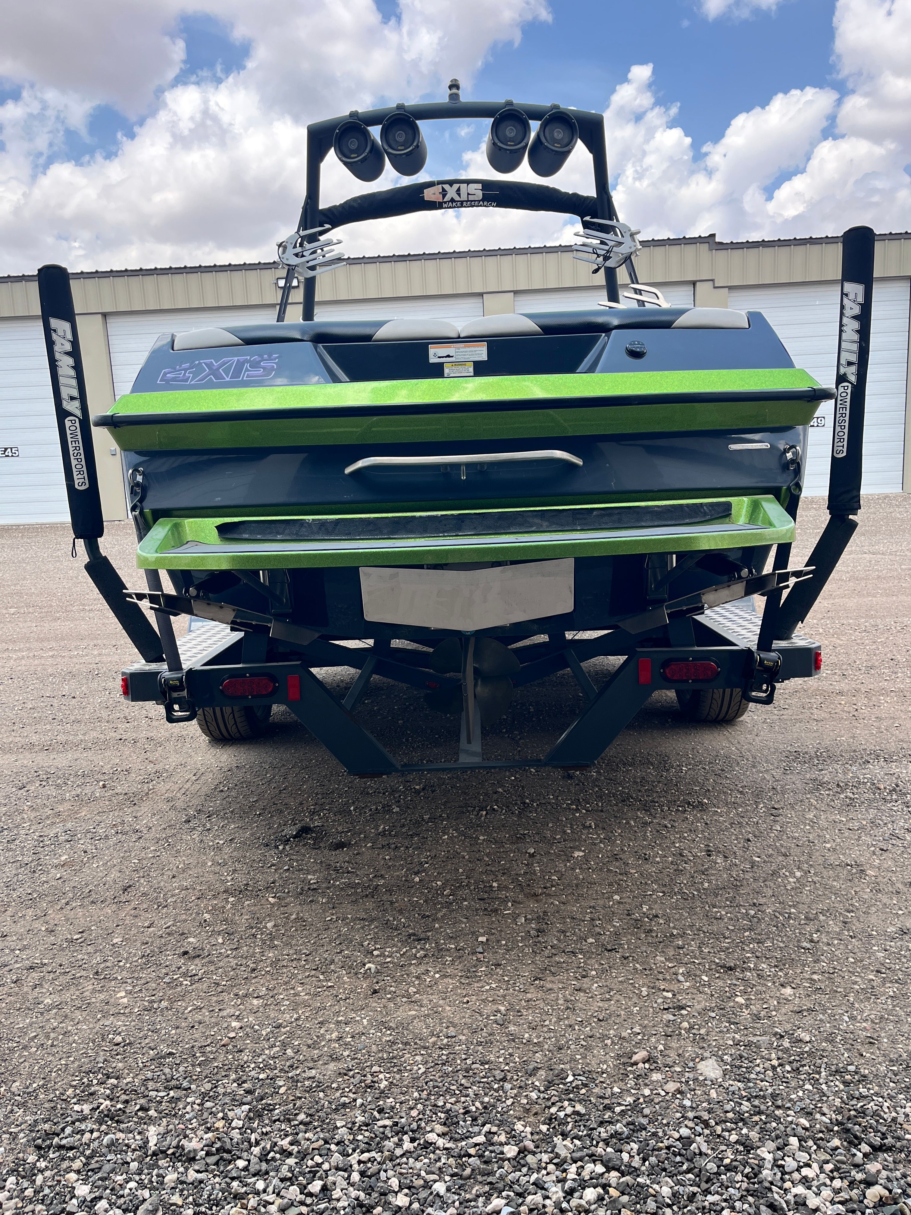 Rear view of a 2013 Axis A22 boat on a trailer.