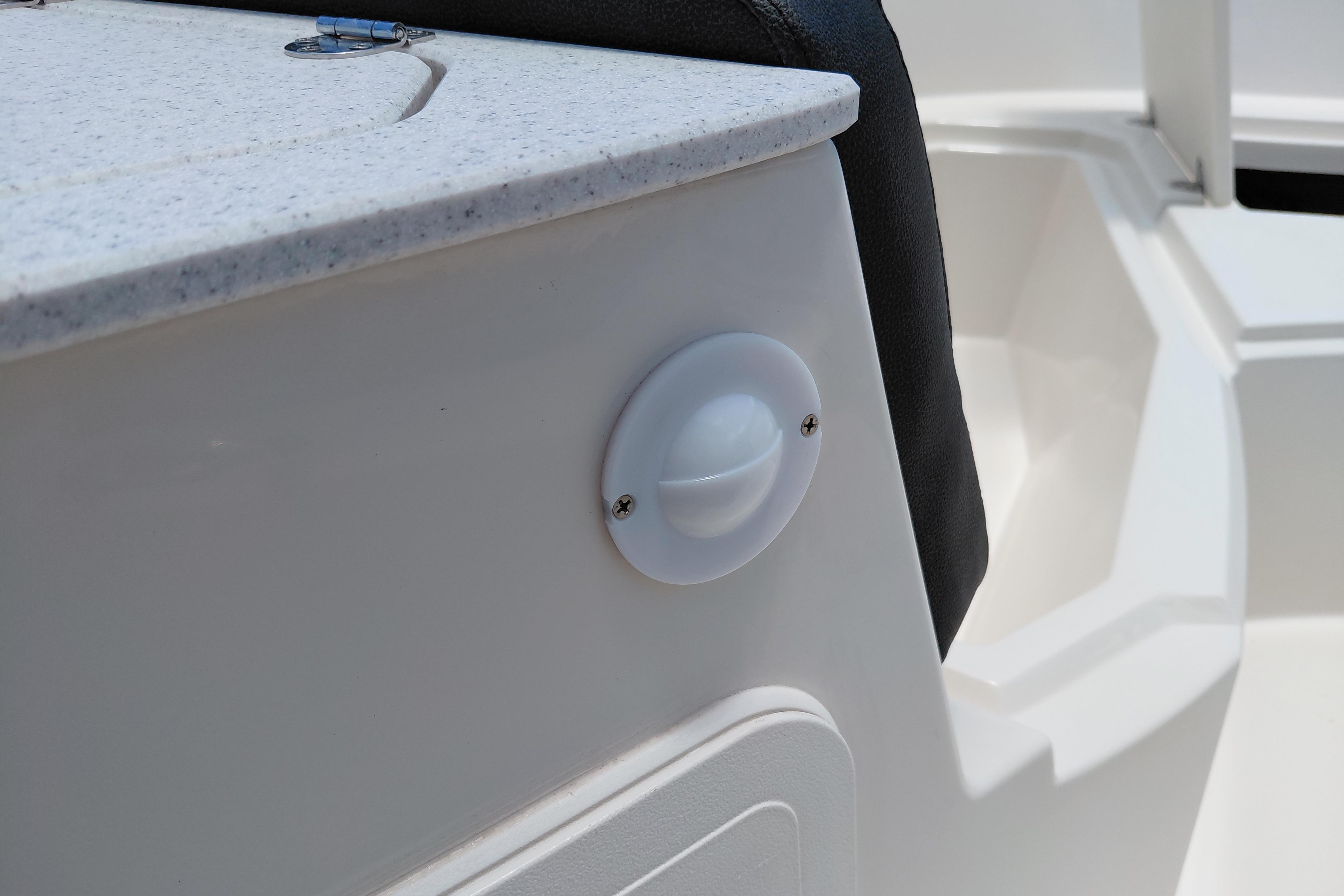 2023 Stingray 206 CC boat interior detail with white panel and black seat.