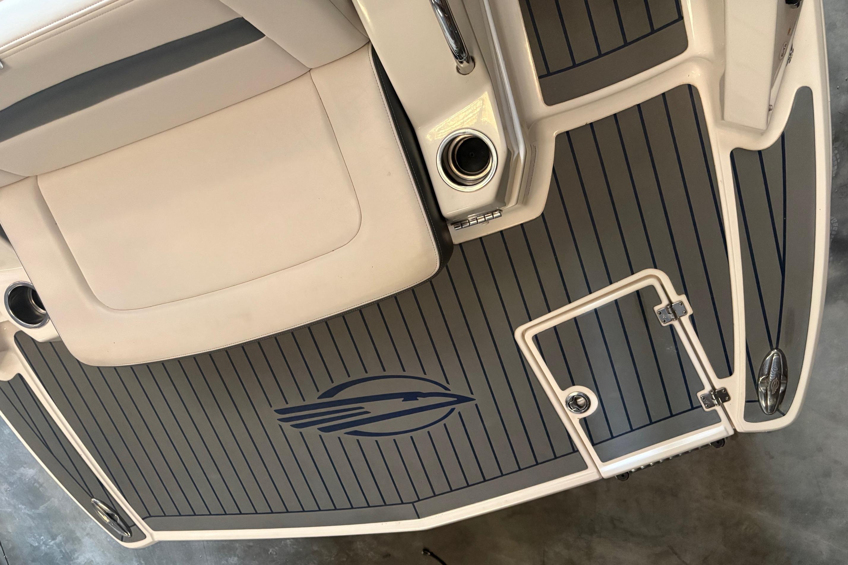 2016 Chaparral 244 Sunesta boat deck with logo and seating area.