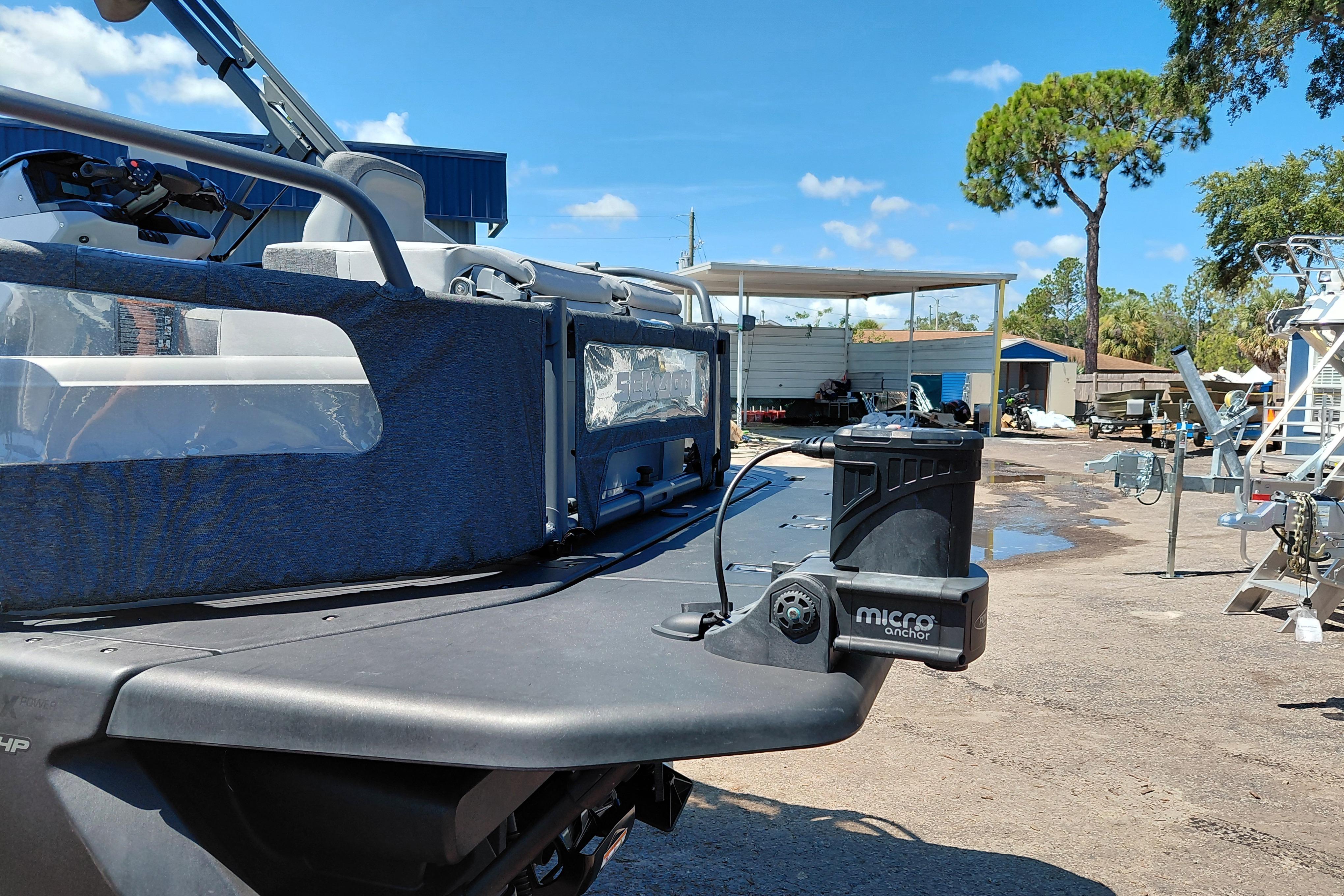 2024 Sea-Doo Switch Cruise 18 with micro anchor, parked outdoors under clear sky.