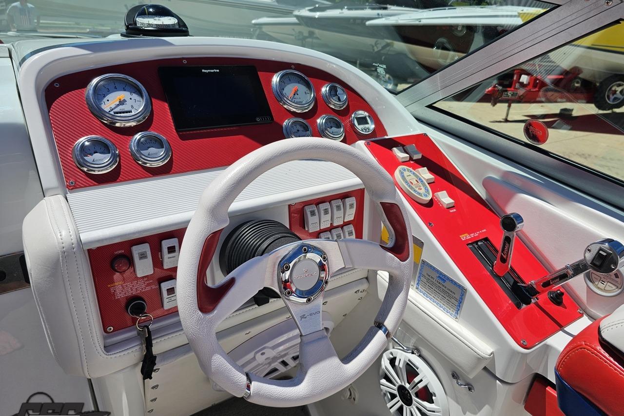 Cockpit of a 2005 Formula 271 FASTech boat with red and white dashboard controls.