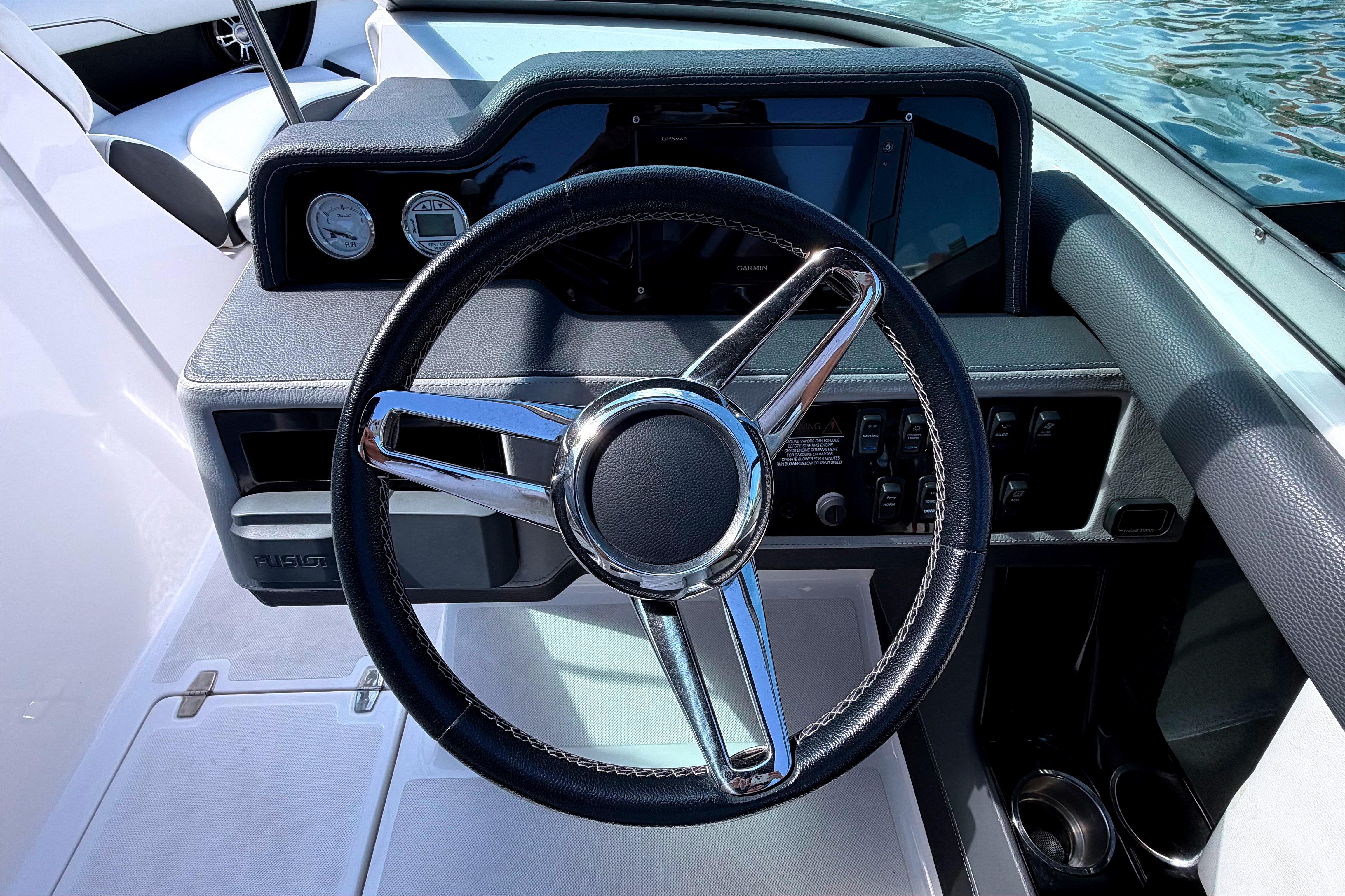 Steering wheel and dashboard of 2020 Regal 2300 Bowrider boat.