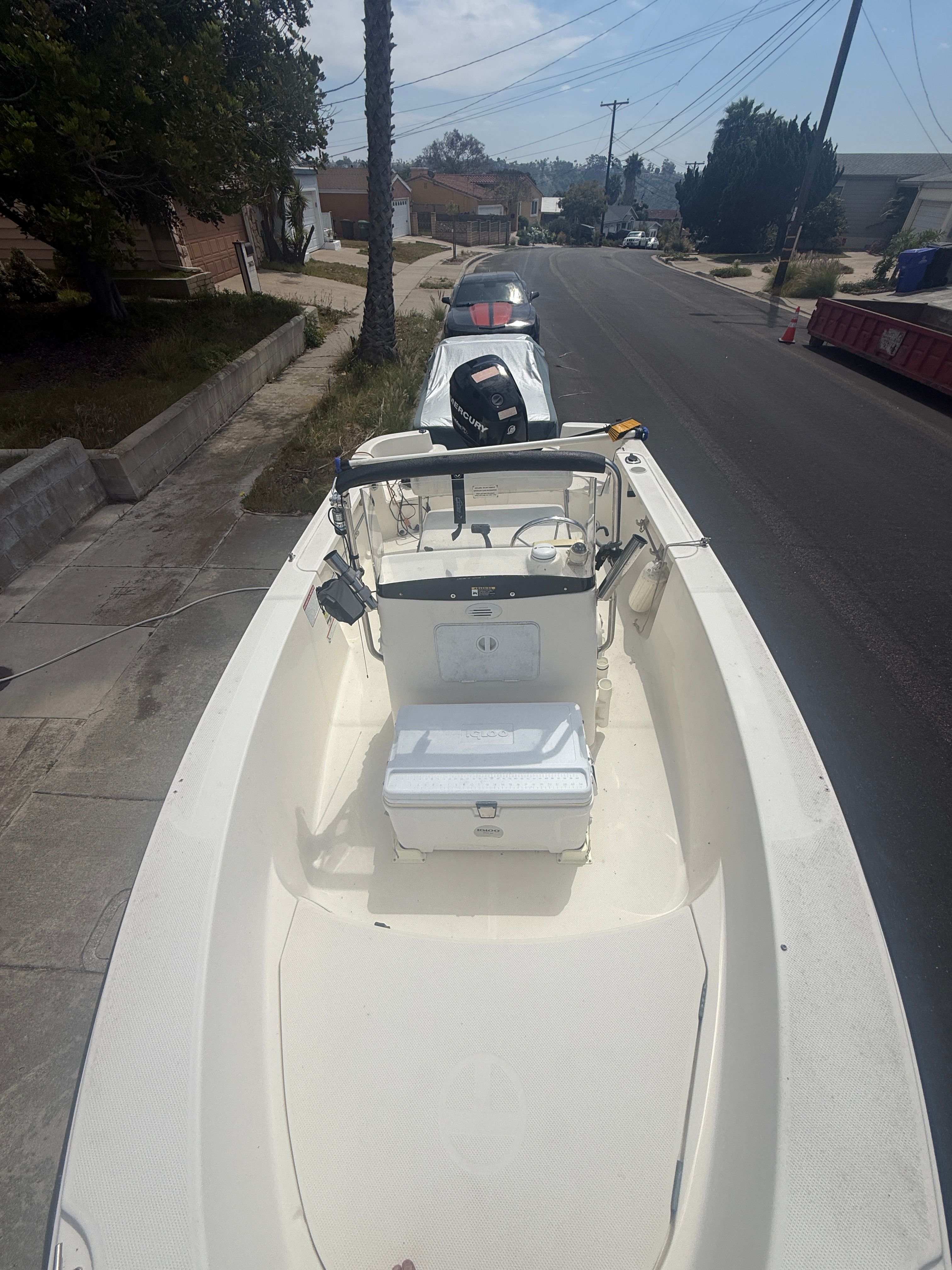 2008 Trophy 1703 Center Console boat parked on street.