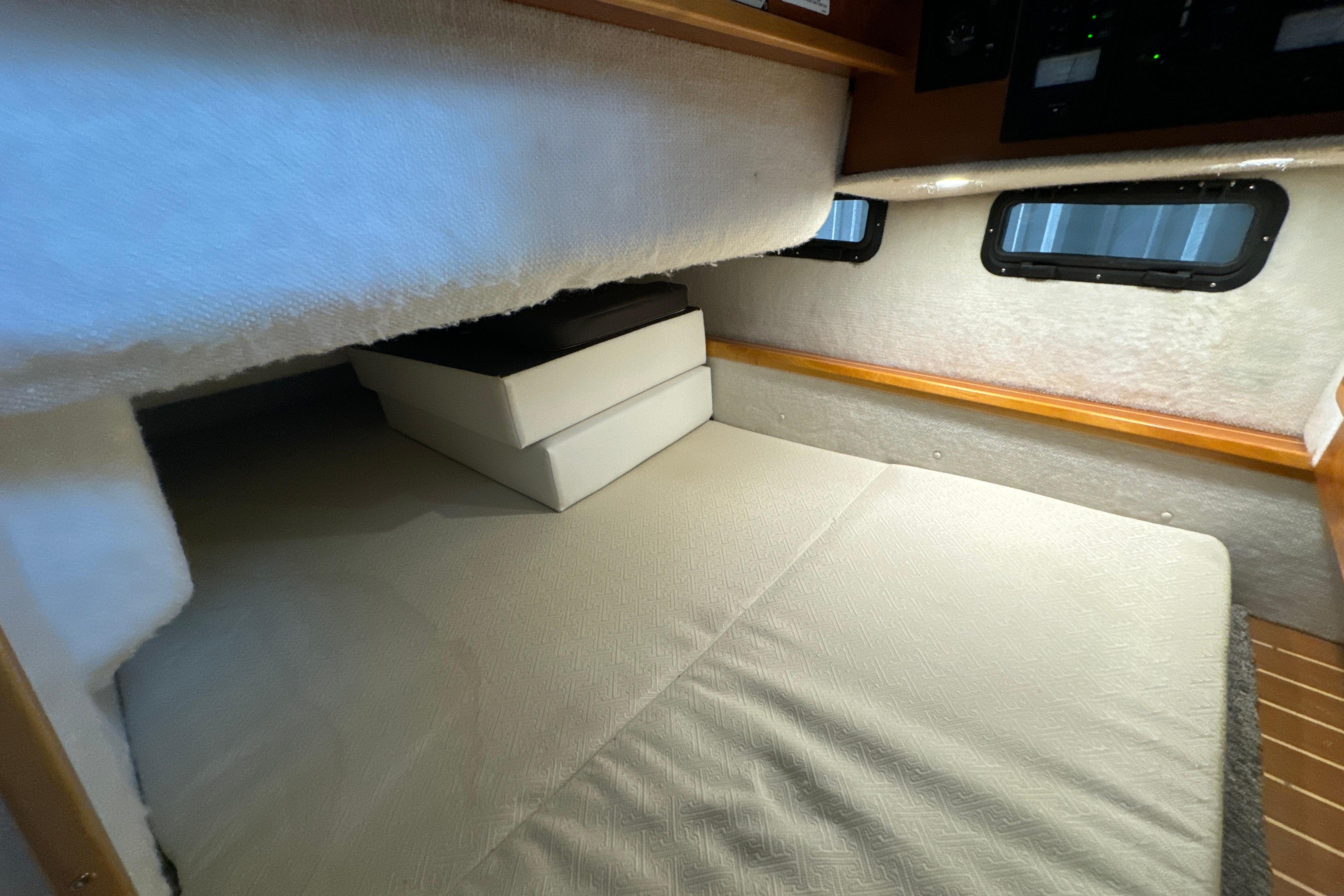 2017 Cutwater C-30 Sedan interior cabin with cozy bed and windows.