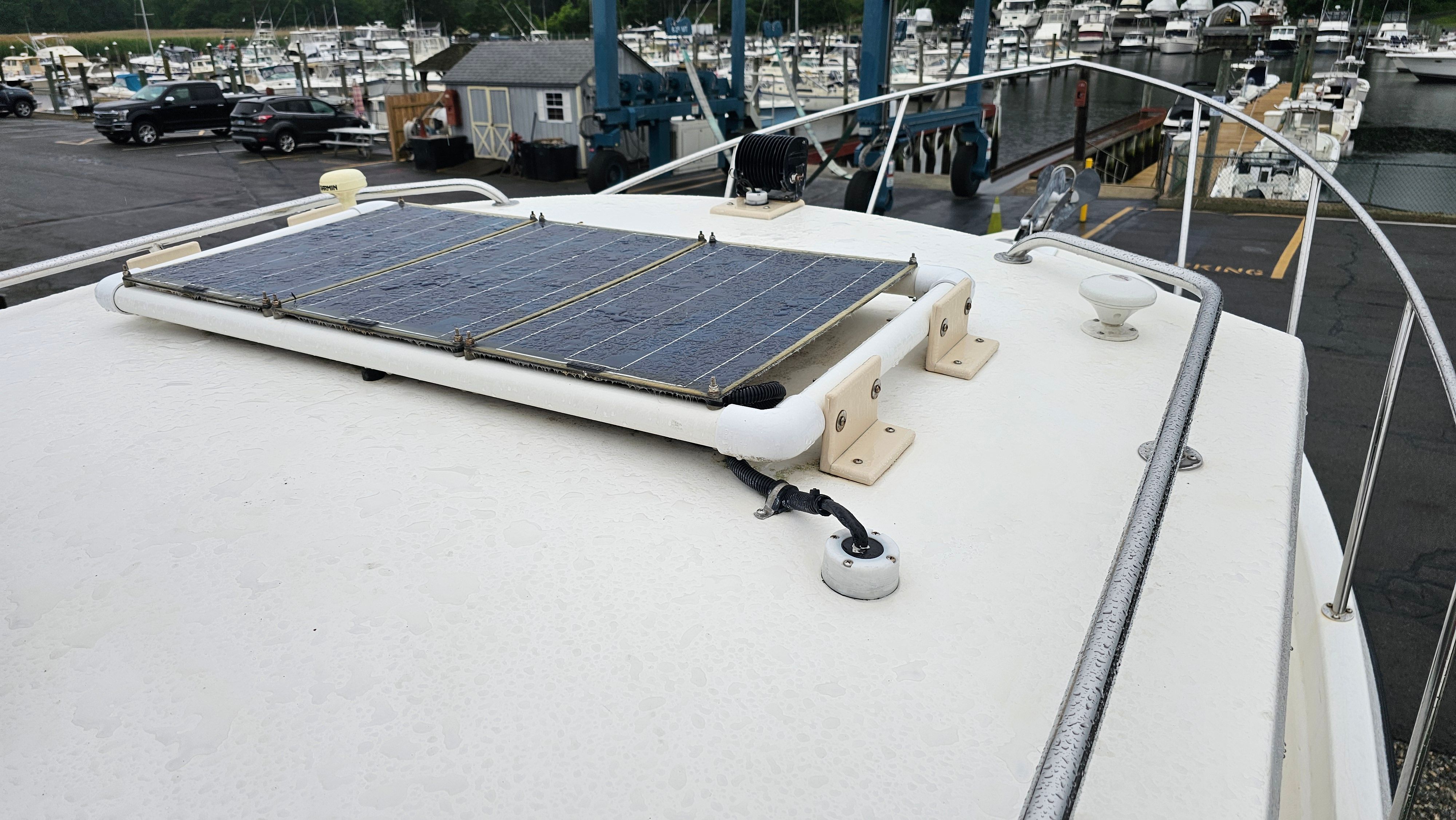 Osprey 26 EXPEDITION 2004 with solar panel on deck at marina.