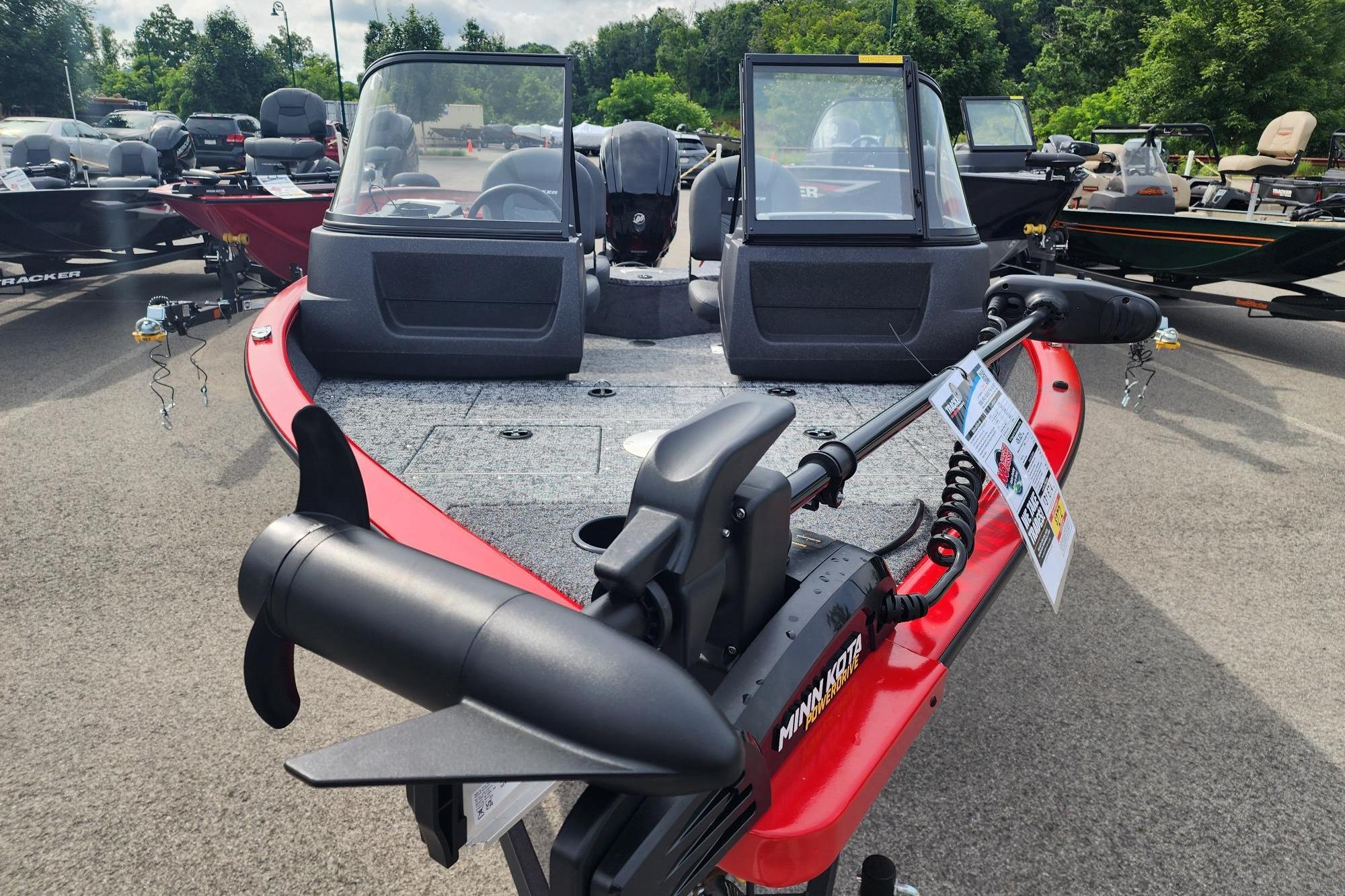 2026 Tracker Pro Guide V-16 WT boat with Minn Kota motor, displayed outdoors.