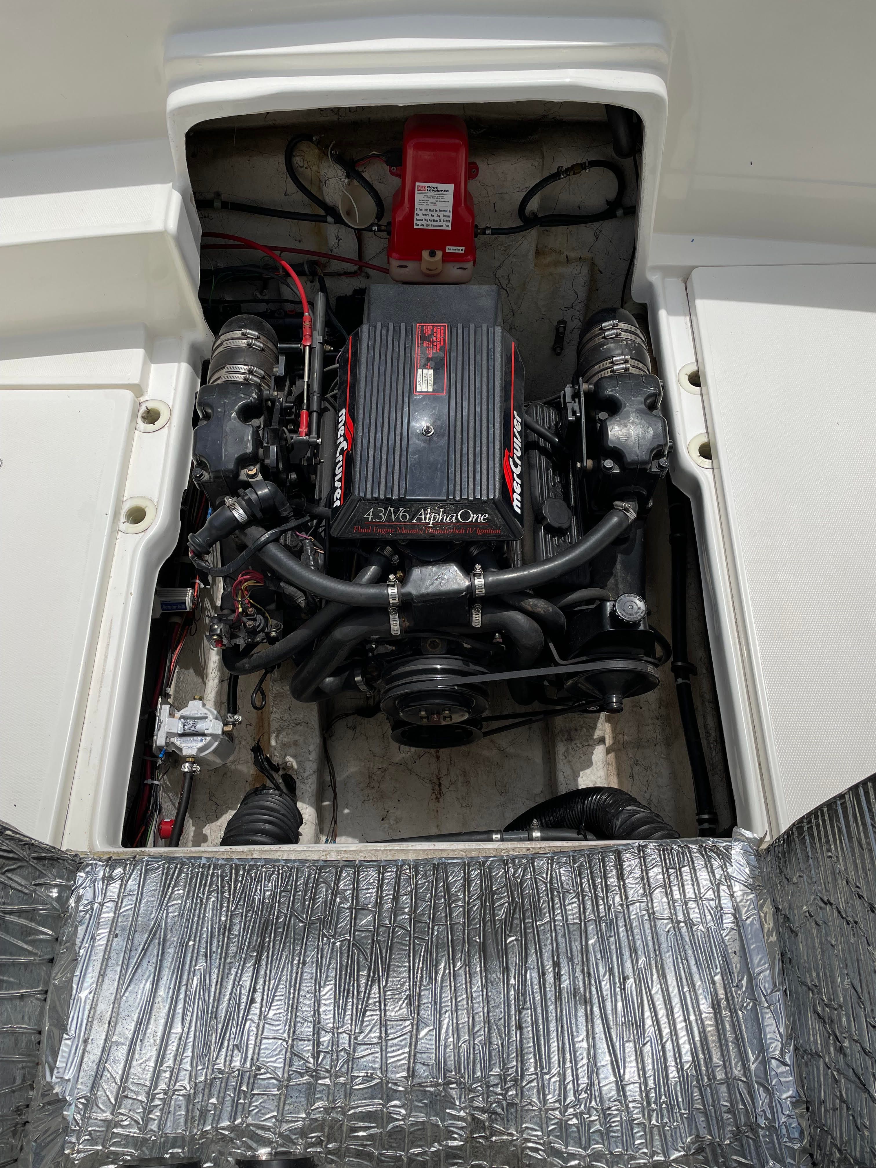 Engine compartment of a 1991 Bayliner 2159 with a 4.3L Alpha One engine.