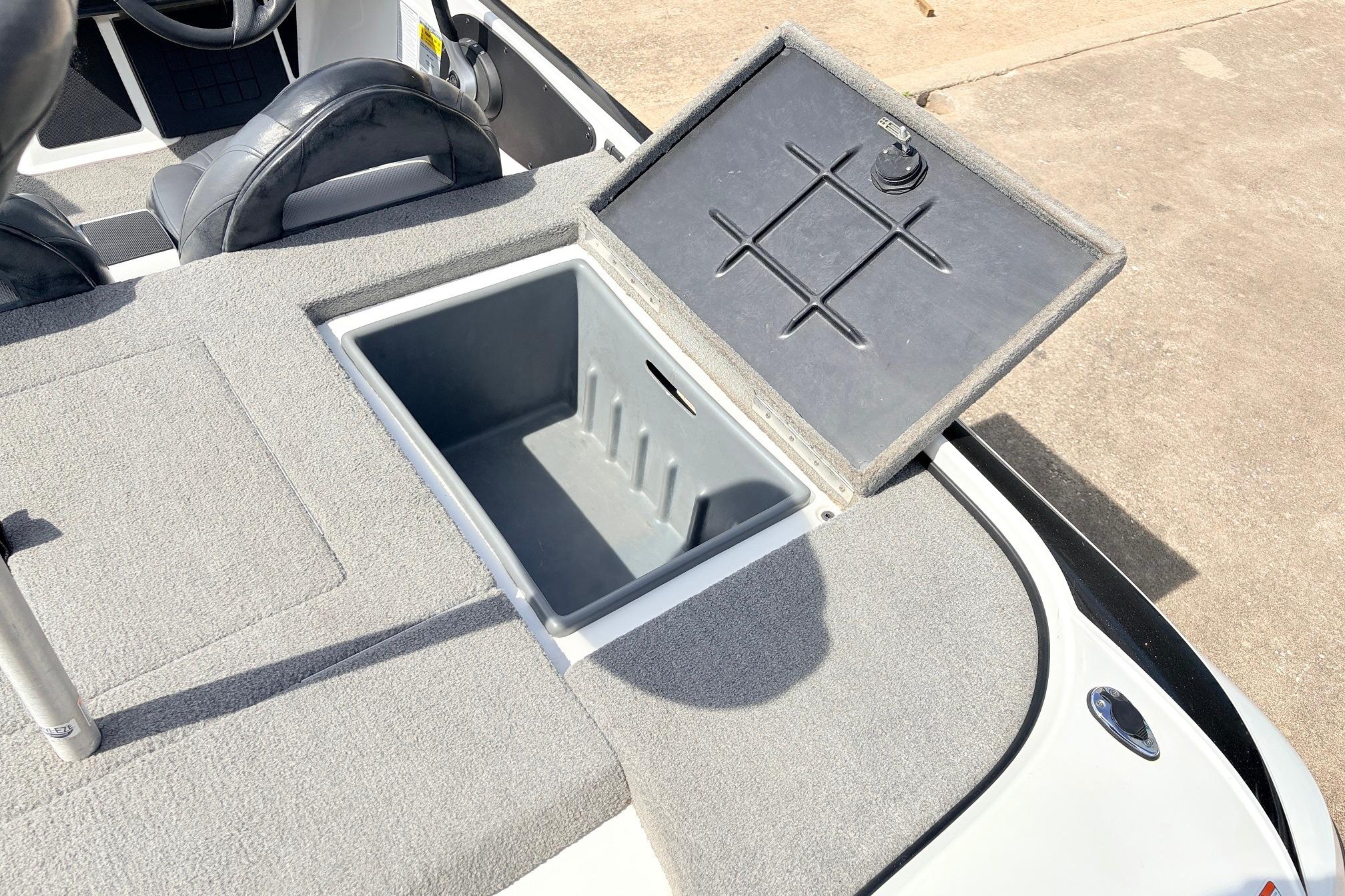 Open storage compartment on 2011 Nitro Z-7 boat with gray interior.