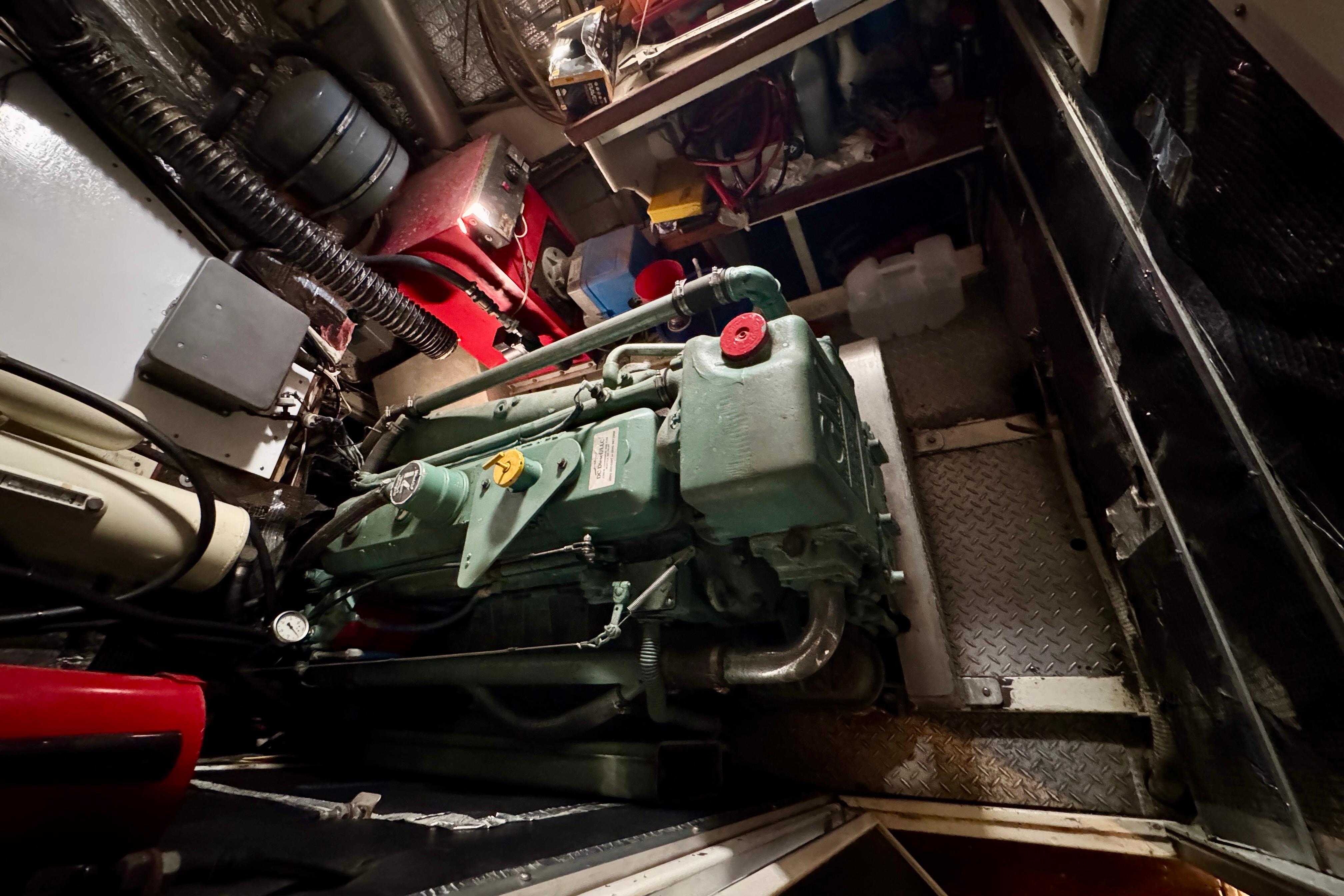 Engine room of a 1958 Blanchard Pilothouse boat, showcasing machinery and components.