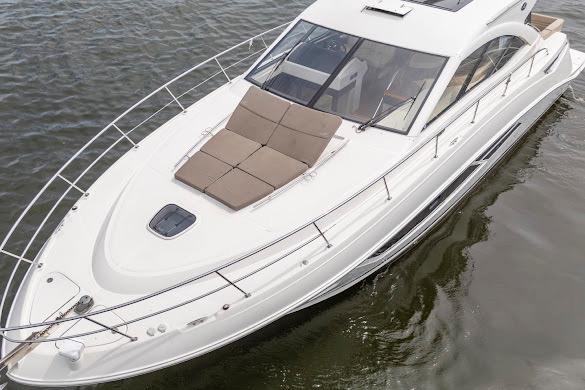 2016 Sea Ray Sundancer 510 yacht with sleek design and spacious deck on calm water.