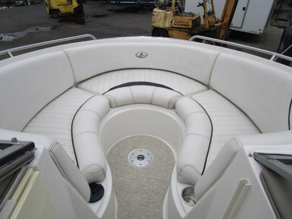 2004 Ebbtide 22 Mystique boat interior with white cushioned seating.