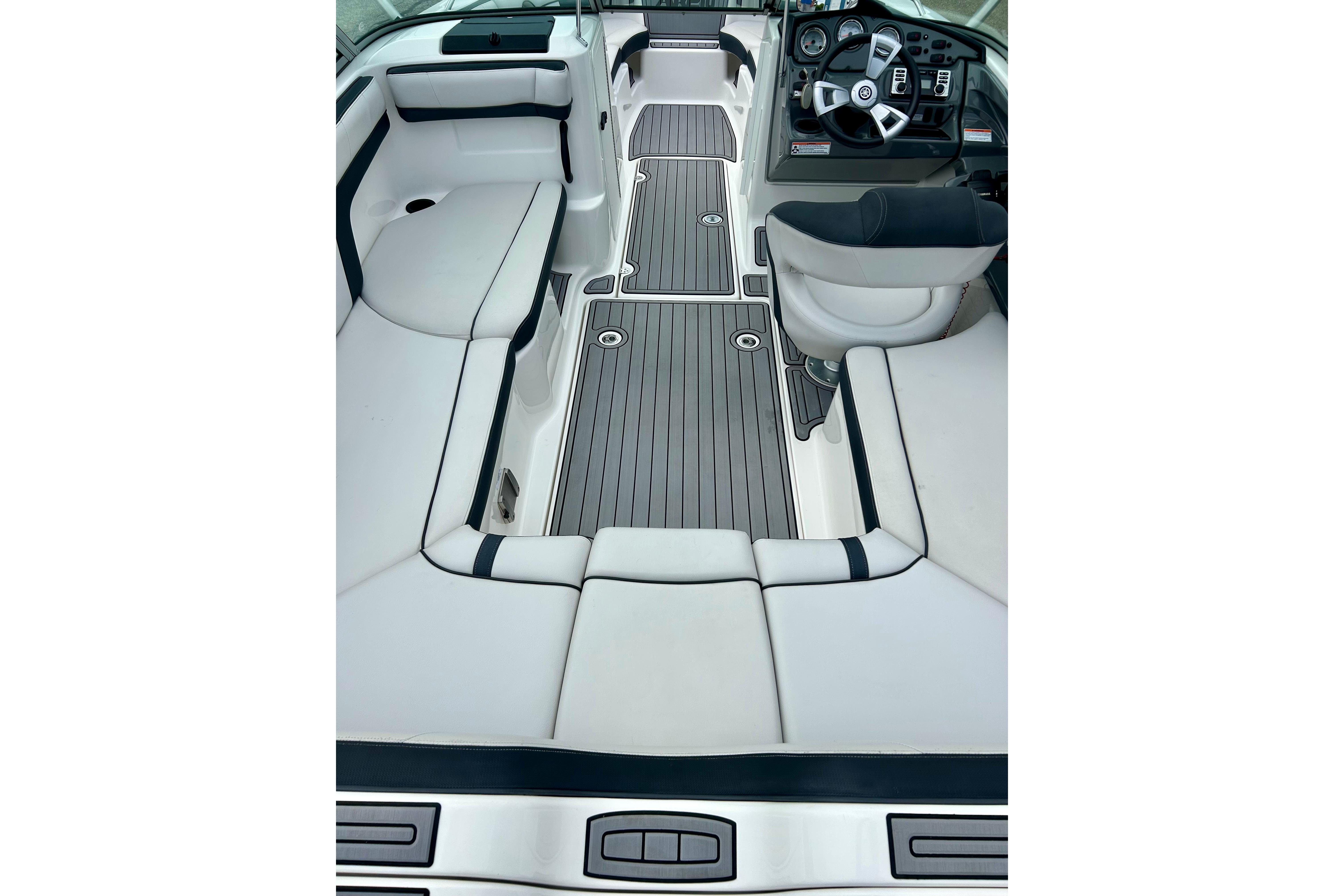 2015 Yamaha Boats AR210 interior with sleek seating and modern dashboard design.