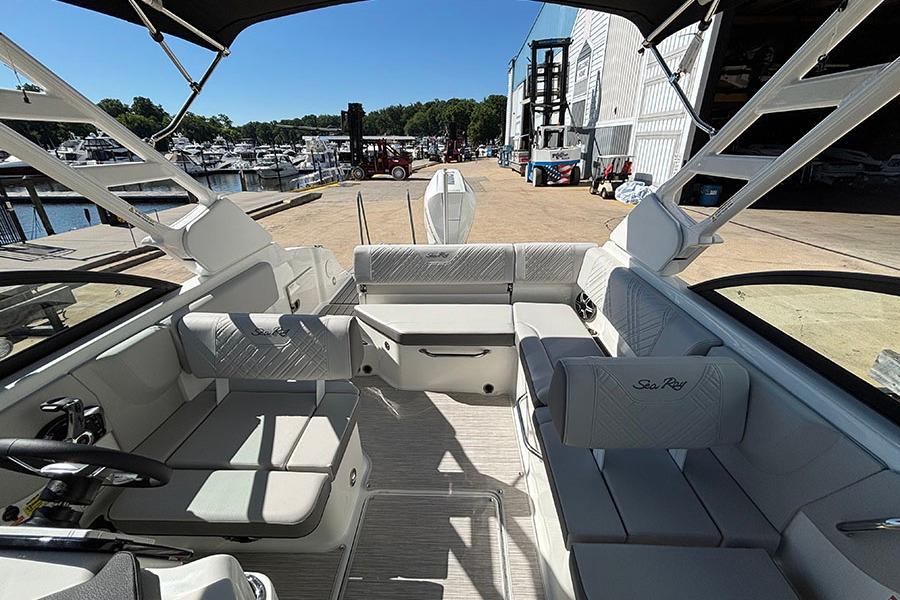 Interior view of 2027 Sea Ray SDX 230 Outboard boat at marina dock.