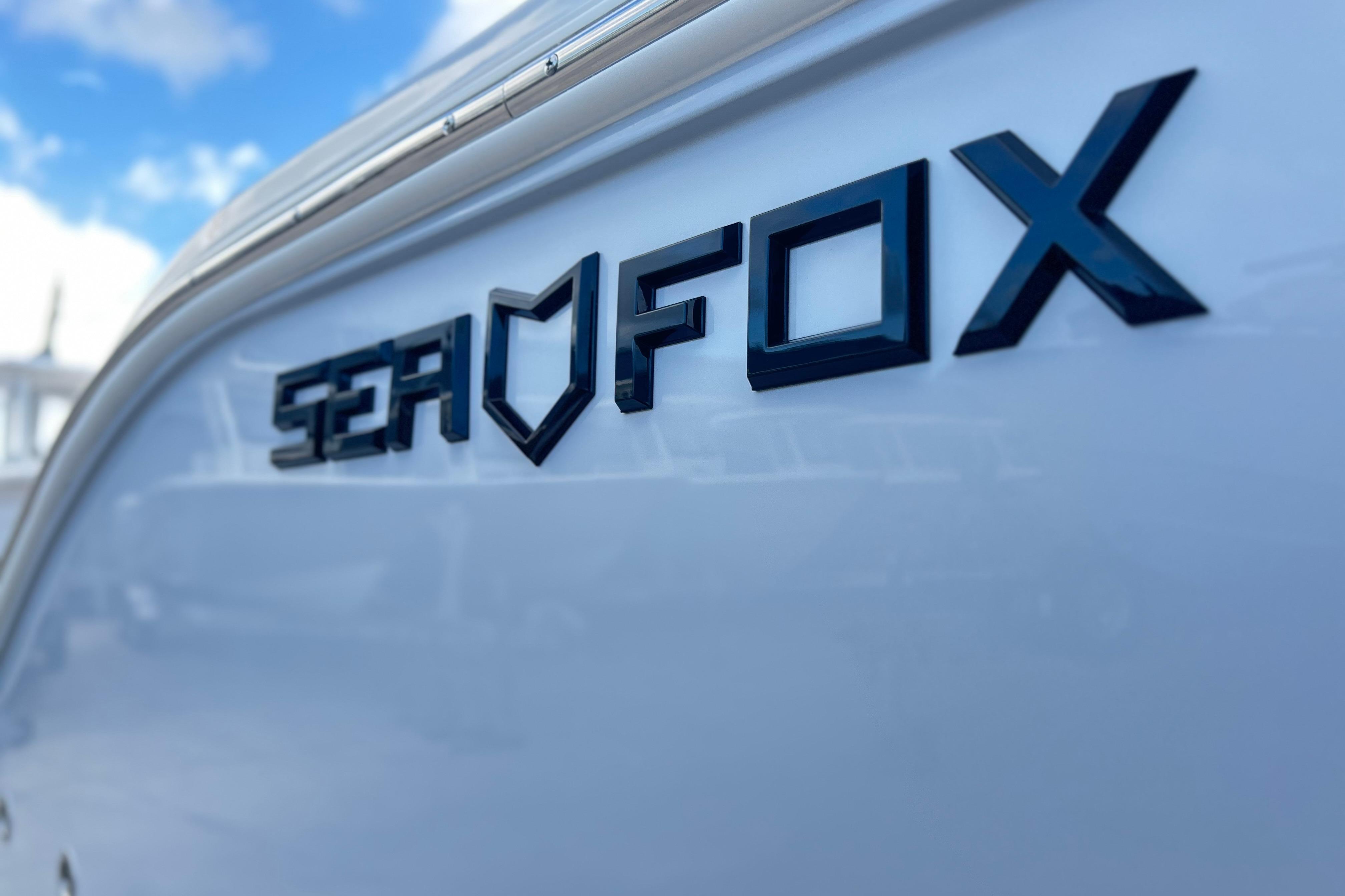 2026 Sea Fox 268 Commander boat logo against a clear blue sky.