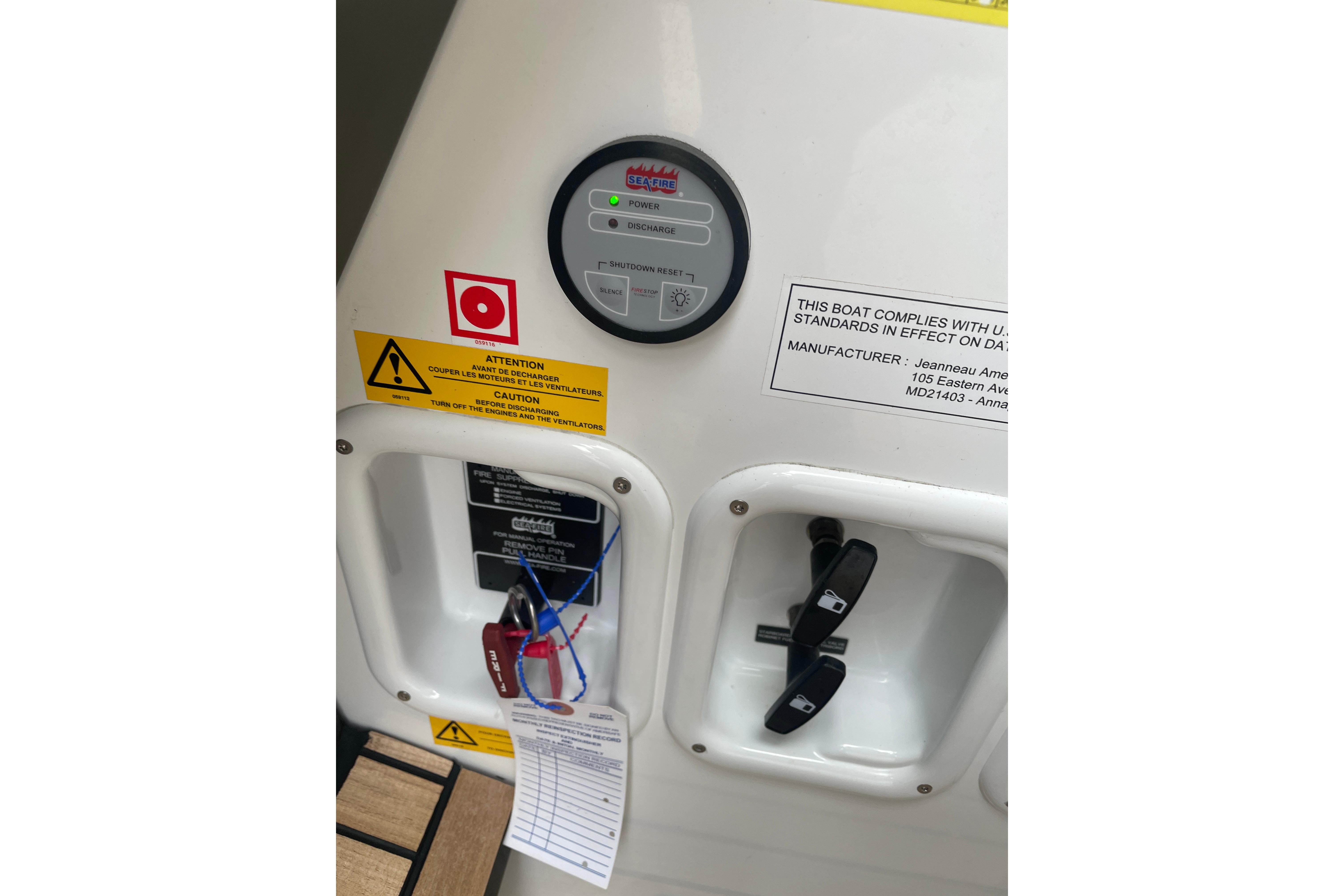 Control panel on a 2017 Jeanneau Leader 46 boat with safety warnings and compliance label.