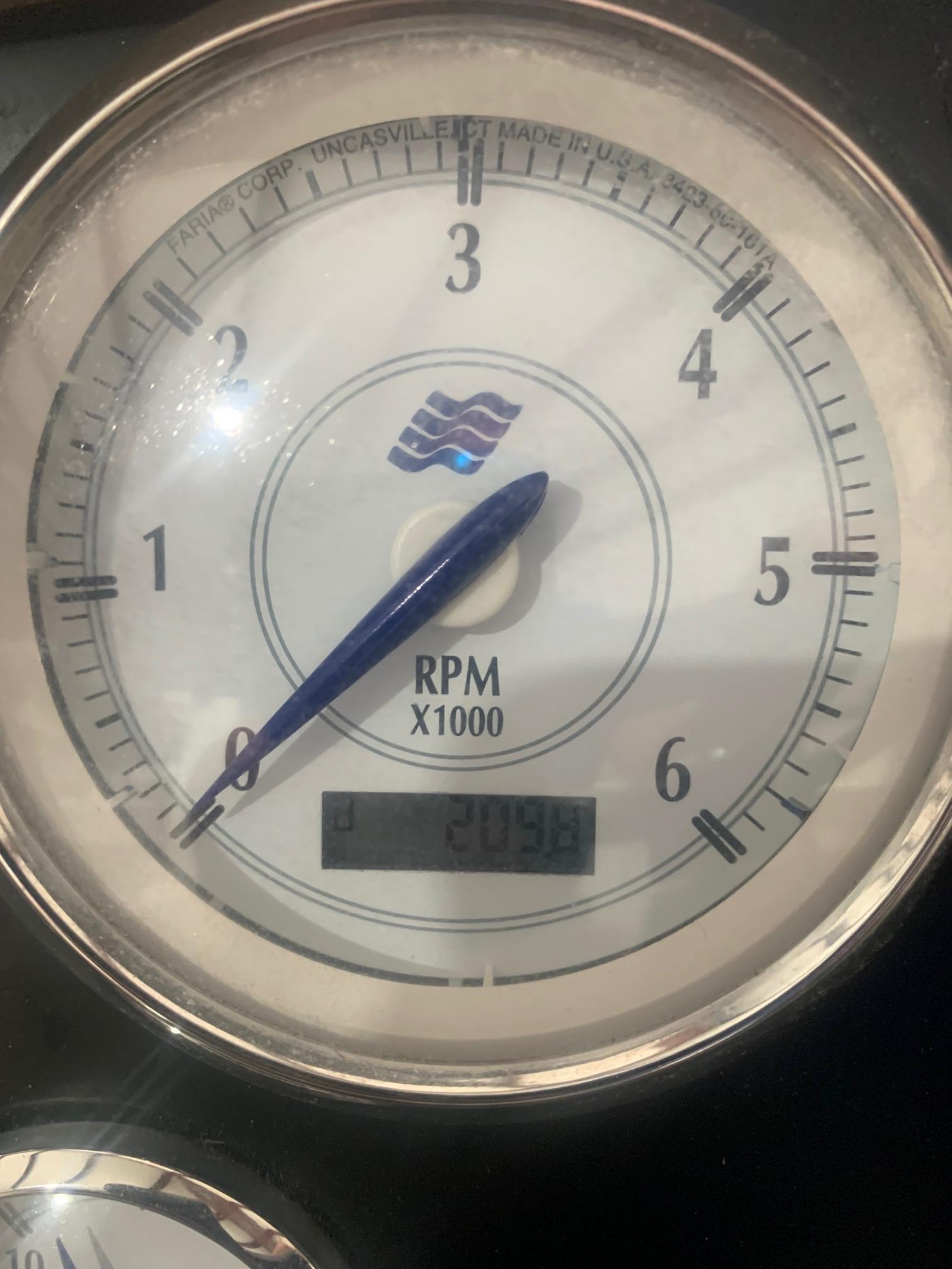 Close-up of 2008 Four Winns V258 tachometer displaying RPM and digital readout.