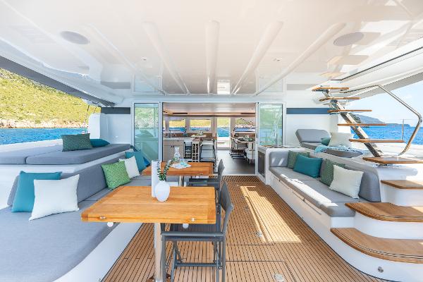 Luxurious Lagoon 60 yacht interior, 2025 model, featuring elegant seating and ocean views.