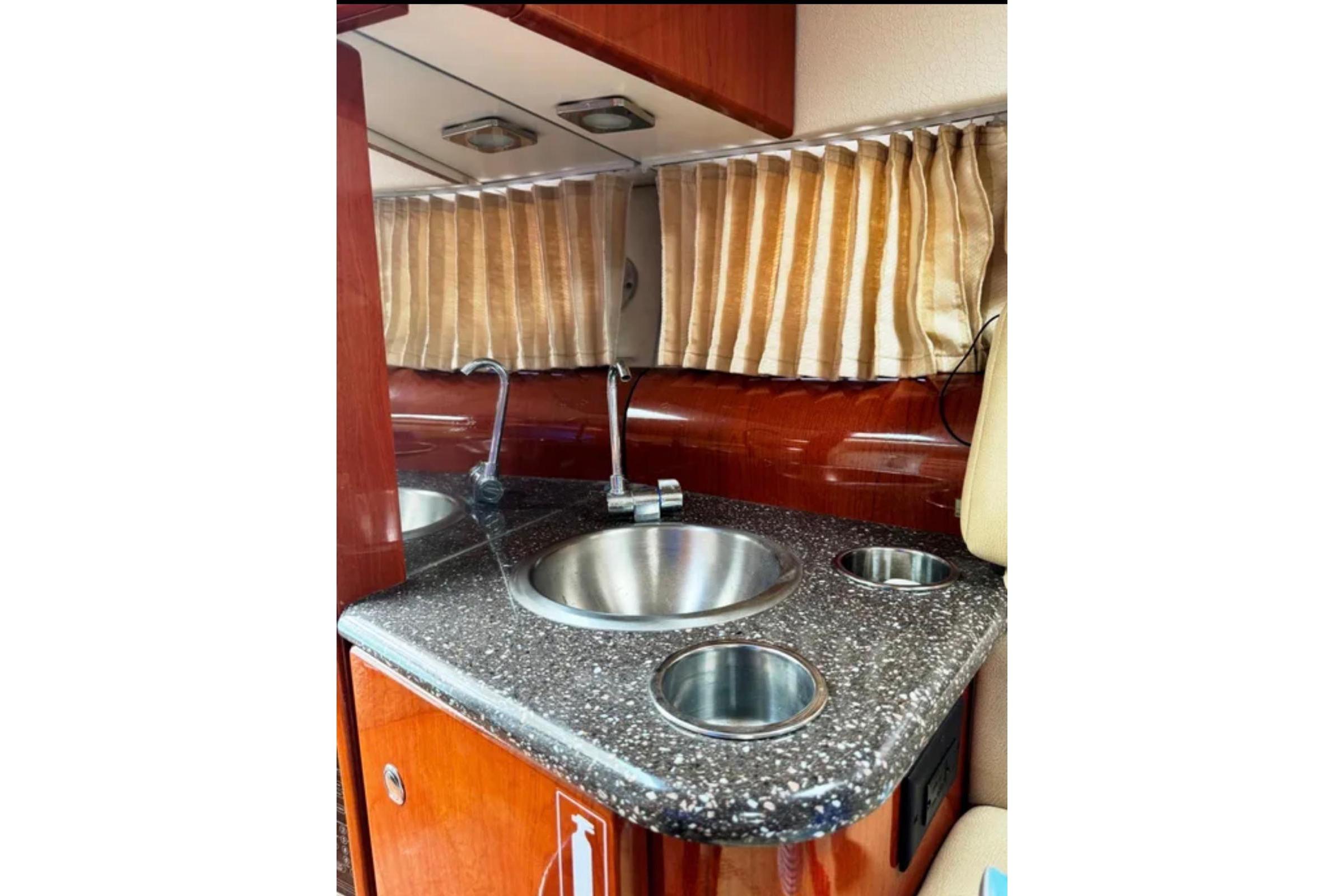 2010 Formula 310 Sun Sport interior with sink and countertop.