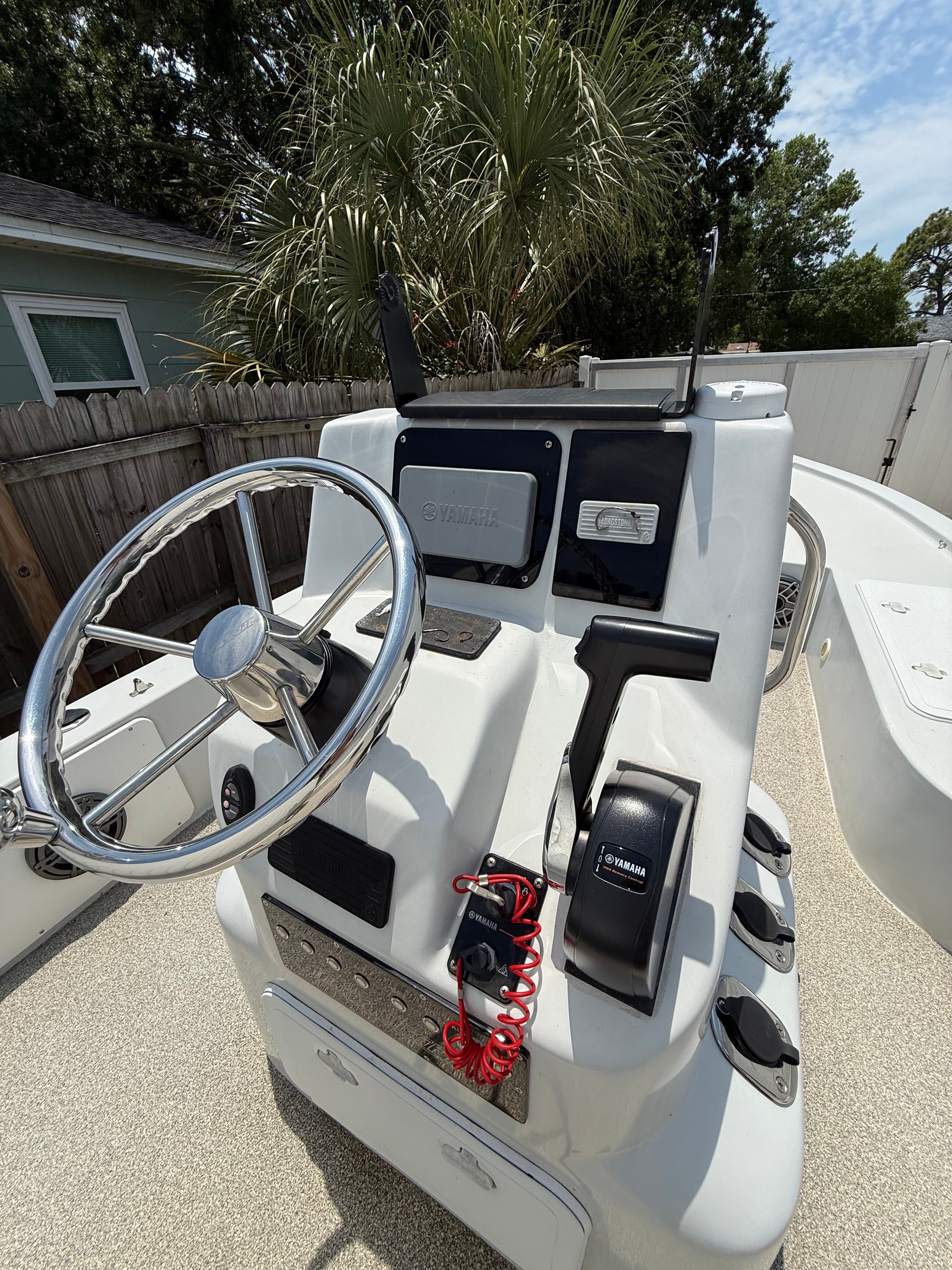 2012 Bay Craft 21 boat console with Yamaha controls and steering wheel.