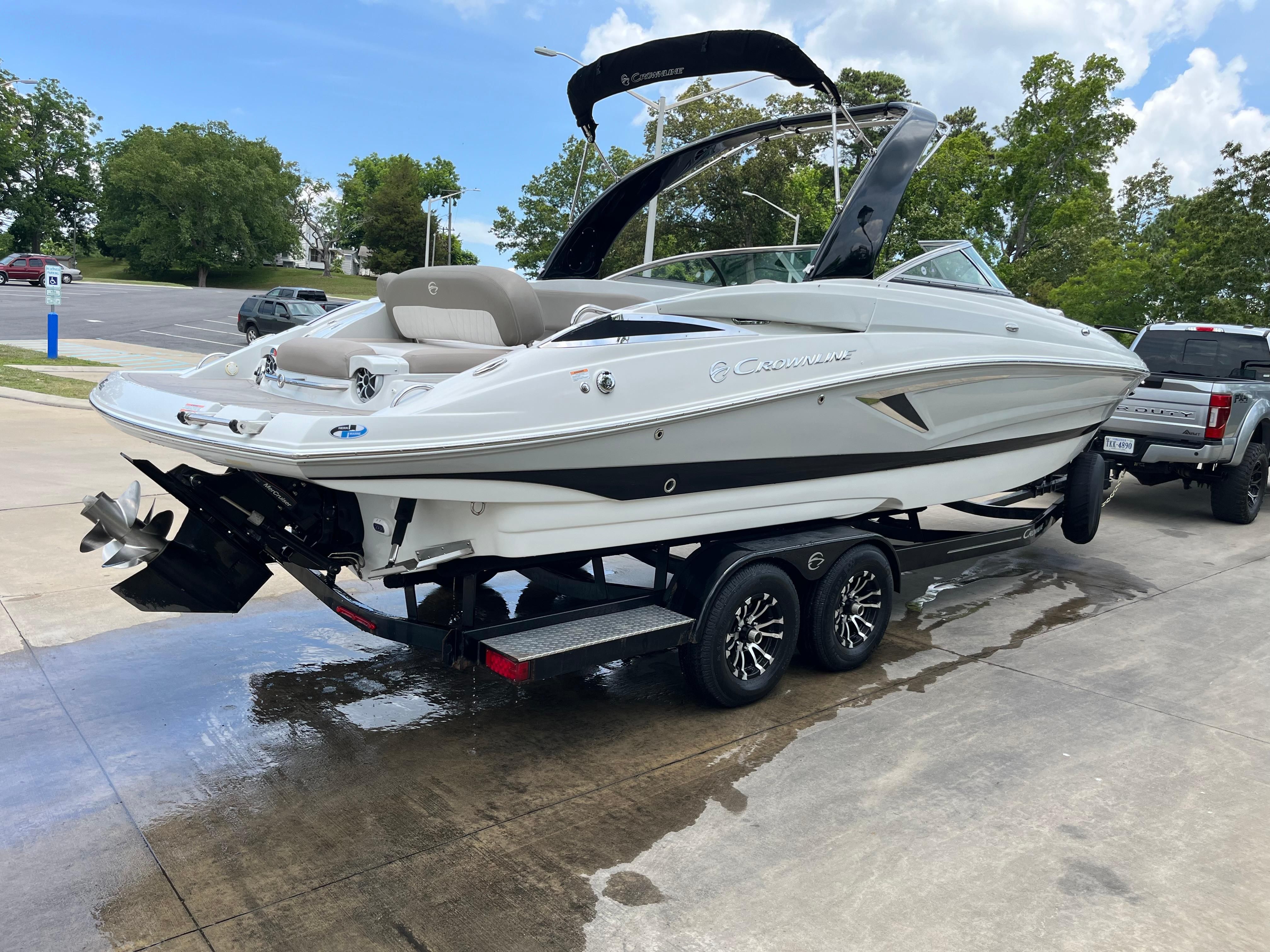 2019 Crownline E 285 on a trailer, ready for transport.