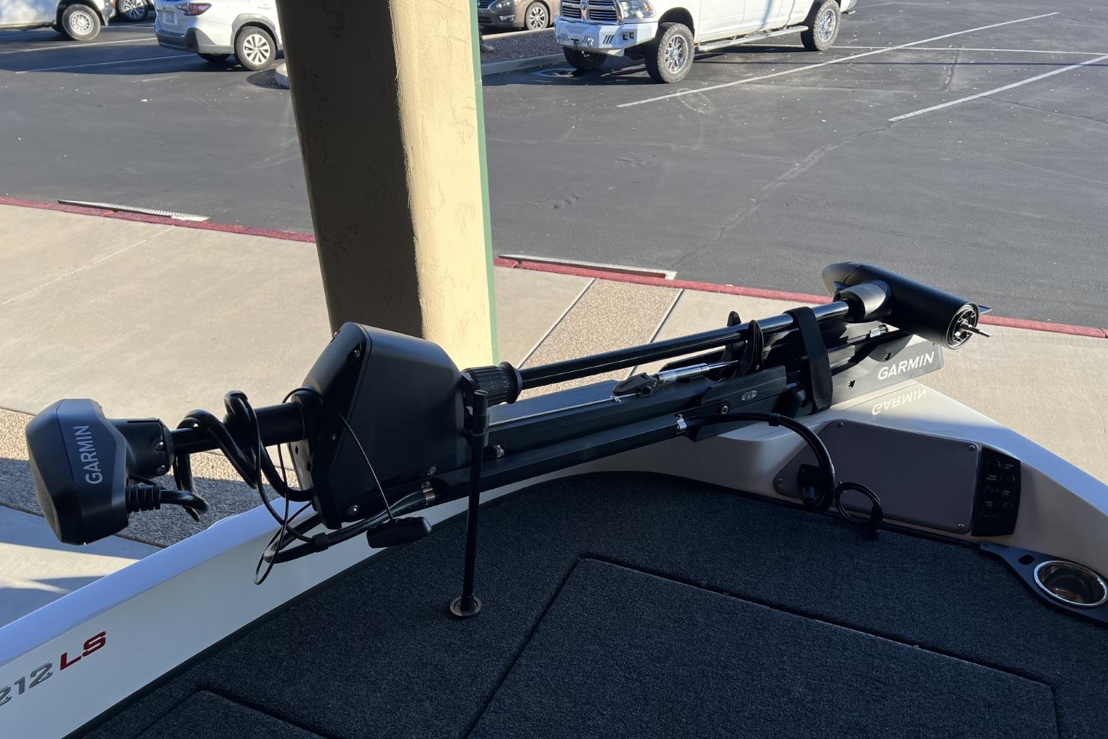 2025 Ranger 212LS boat with Garmin trolling motor in parking lot.