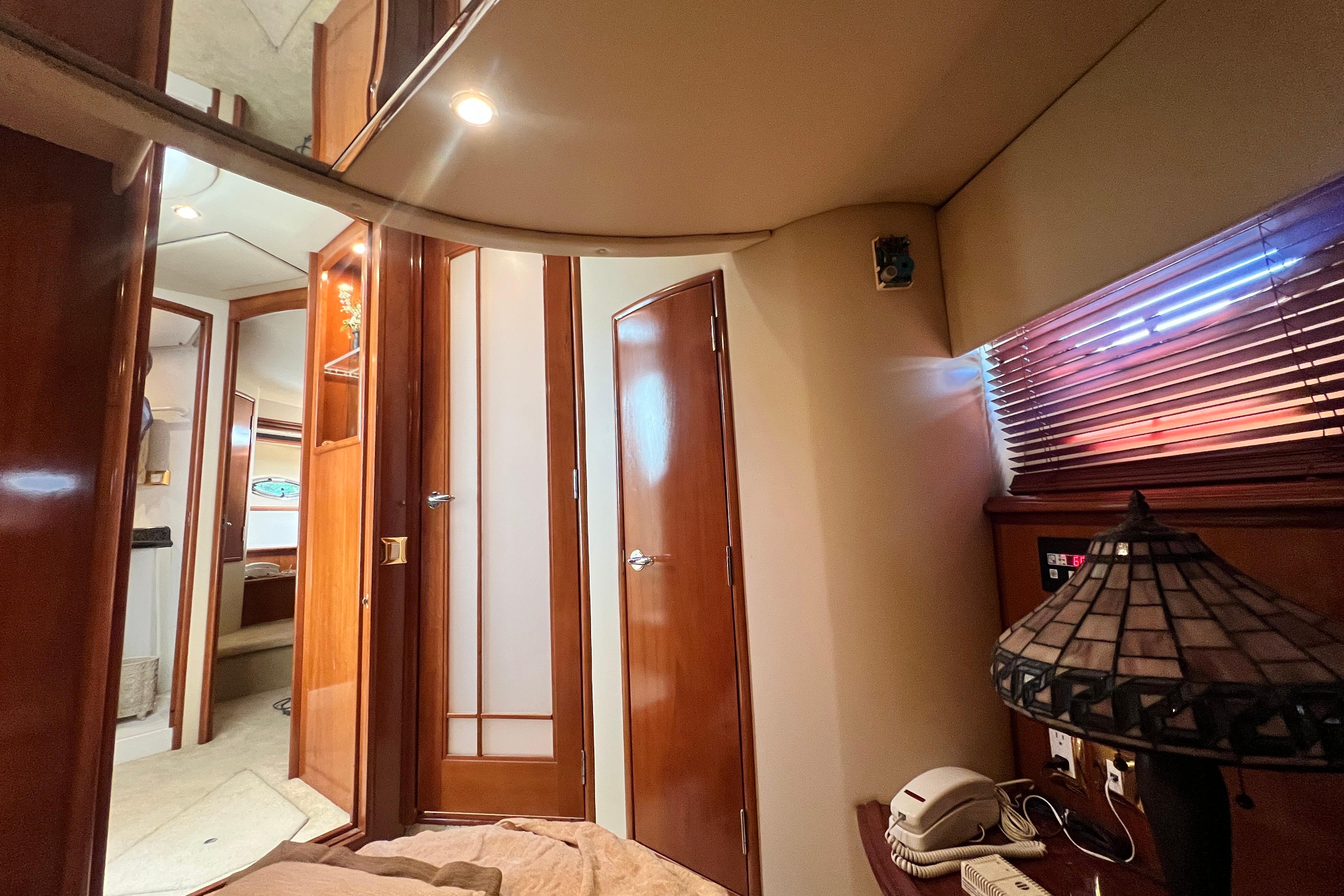 Interior of 2003 Carver 450 Voyager Pilothouse with wood paneling and cozy lighting.